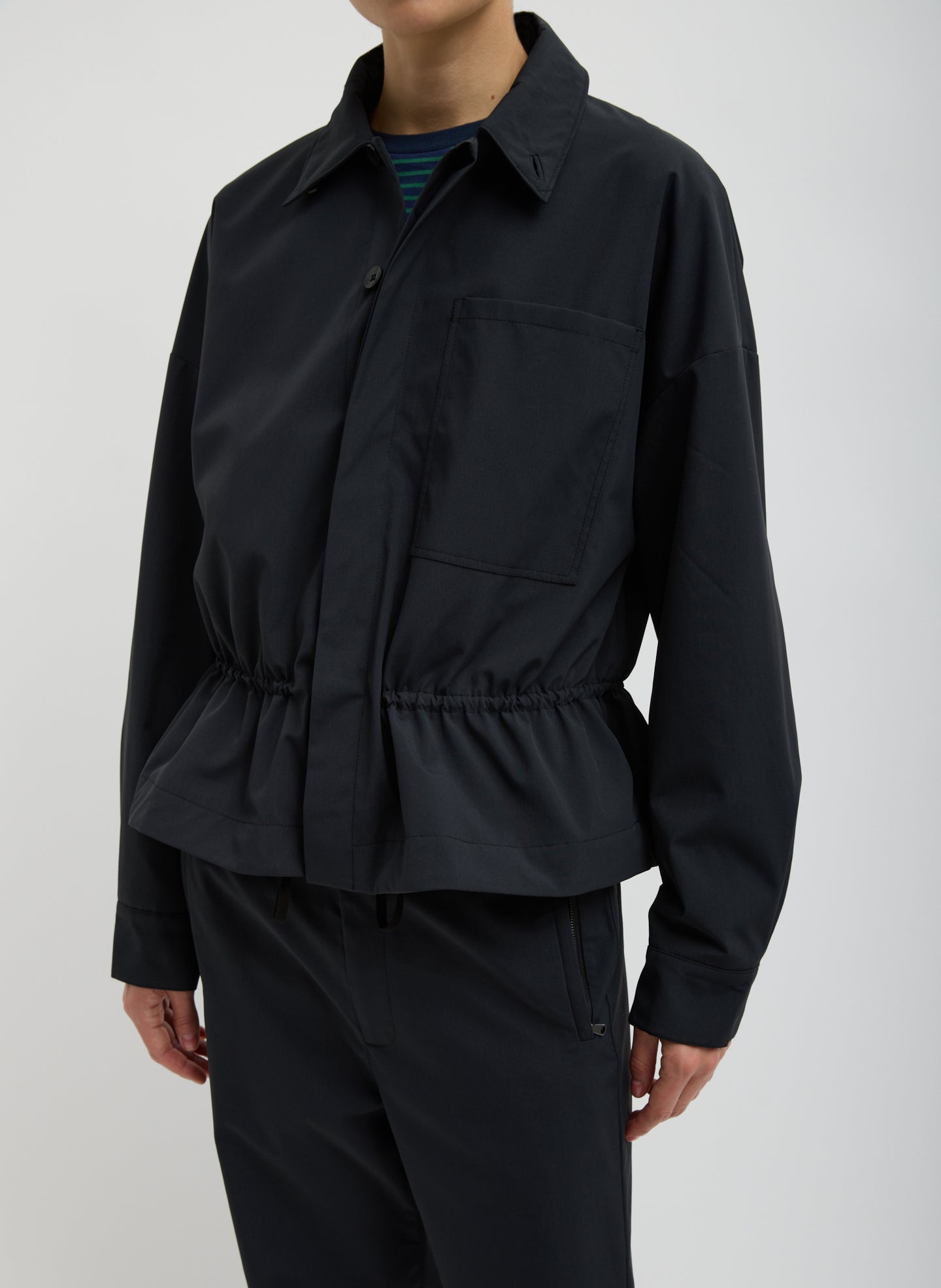 Black Tech Suiting Anorak Bomber - video on model - front view on model