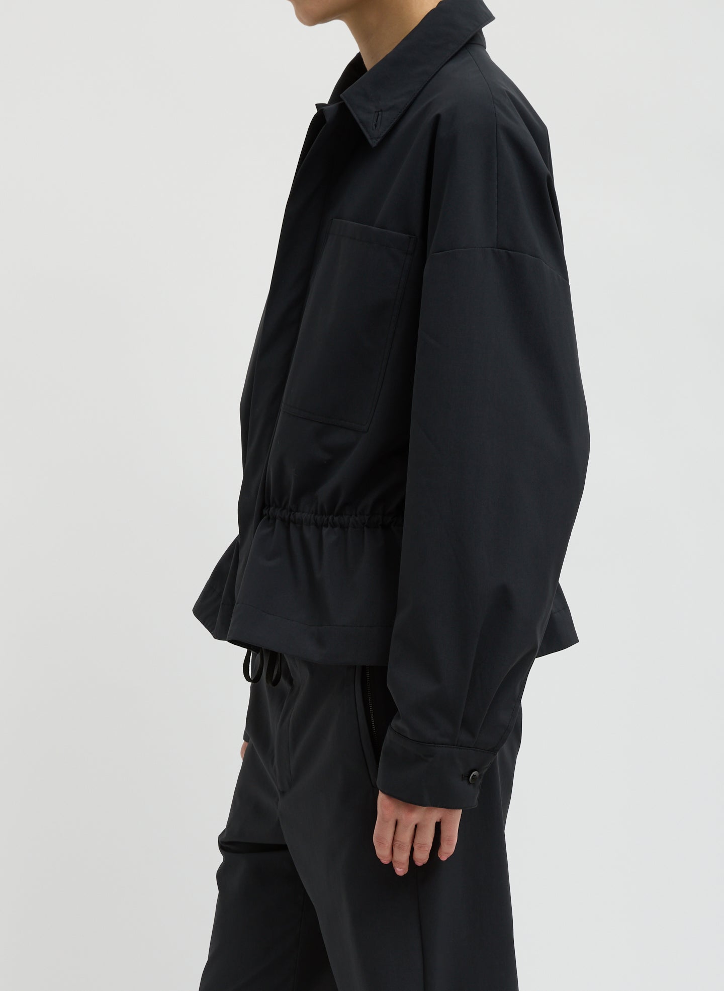 Black Tech Suiting Anorak Bomber - video on model - side view on model