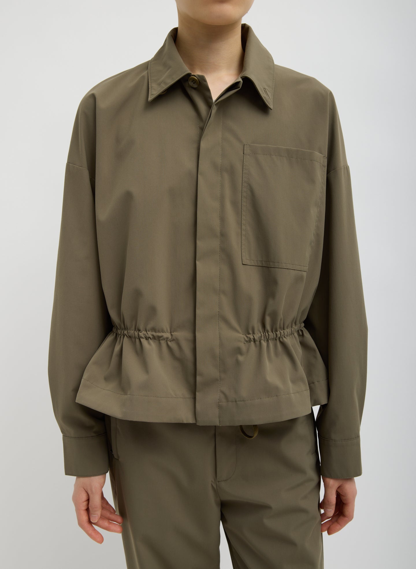 Dark Hazelnut Green Tech Suiting Anorak Bomber - front view on model