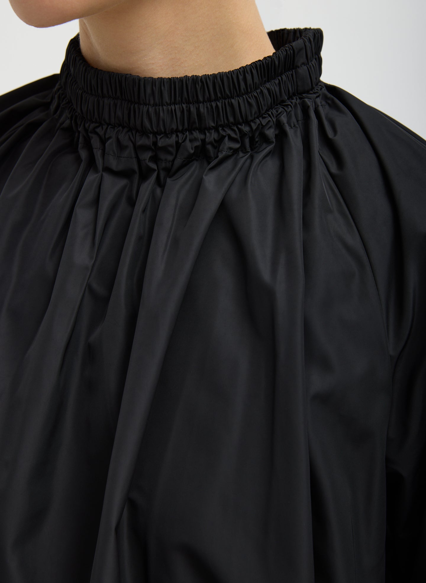 Black Italian Sporty Nylon Shirred Anorak Top - closeup of shirred neck