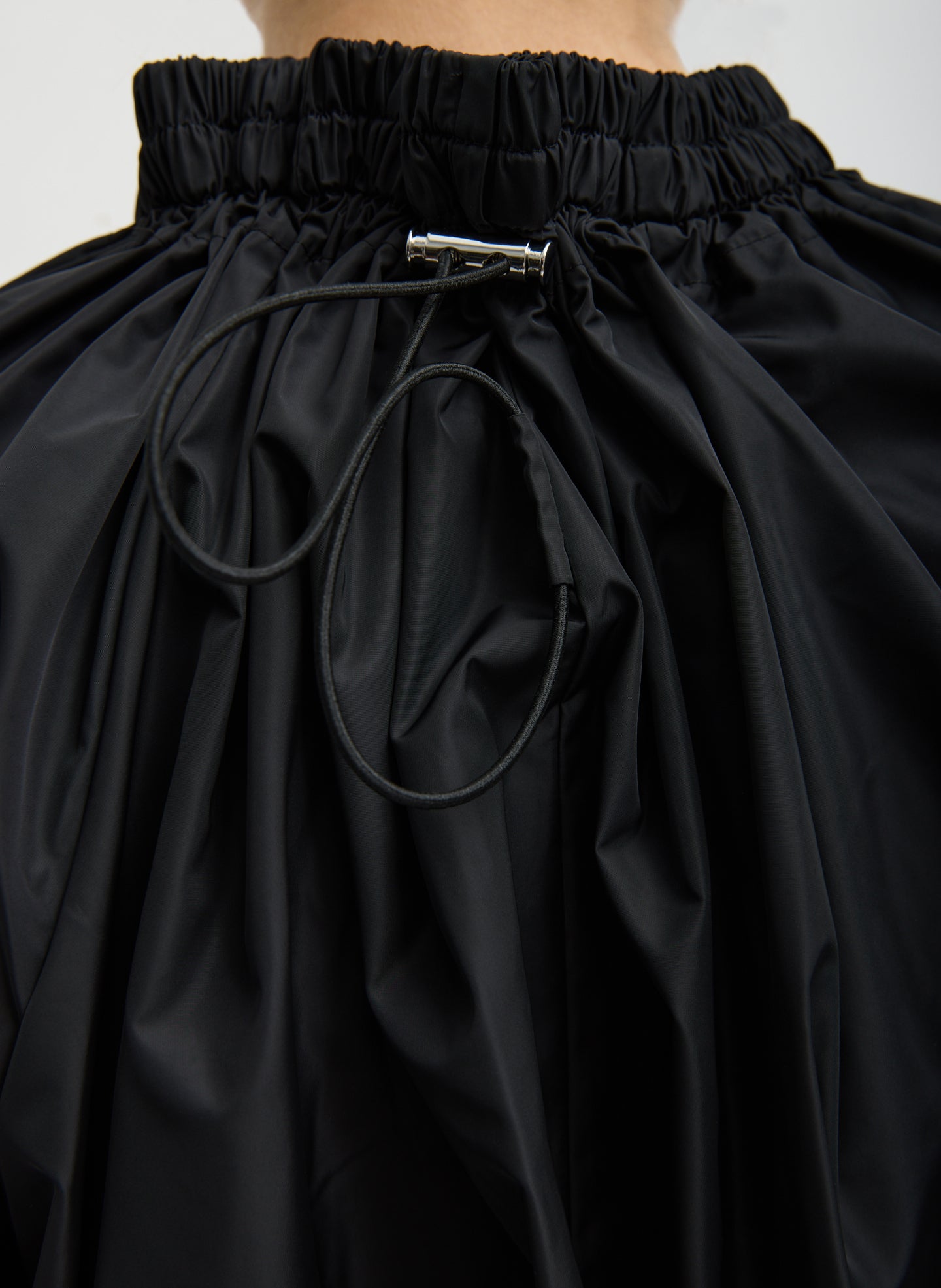 Black Italian Sporty Nylon Shirred Anorak Top - closeup of drawstring detail at back