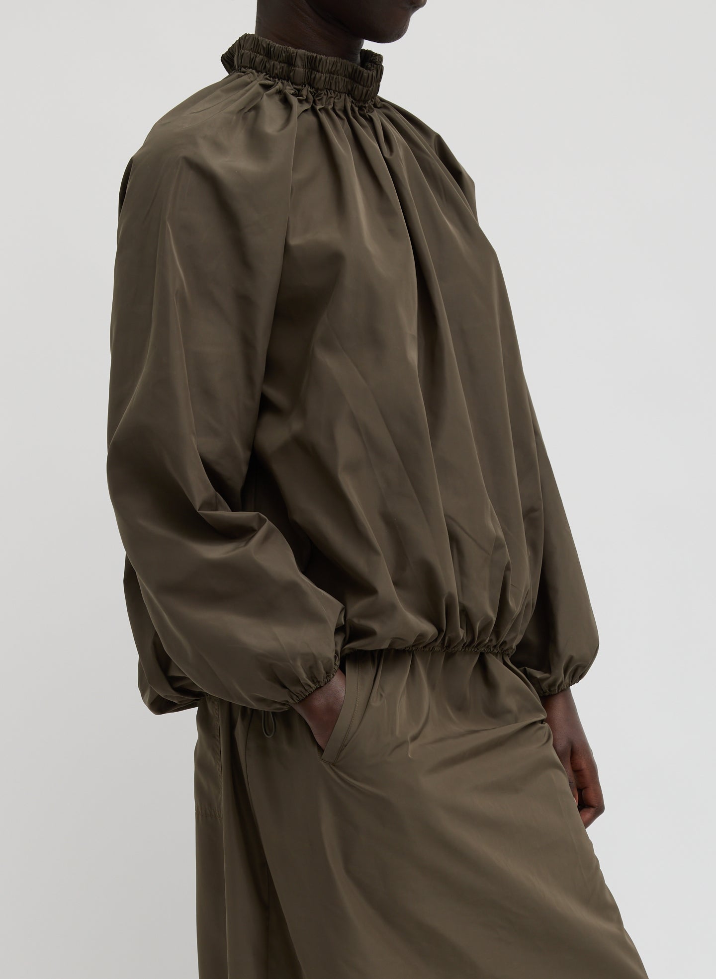 Dark Hazelnut Green Italian Sporty Nylon Shirred Anorak Top - side view on model