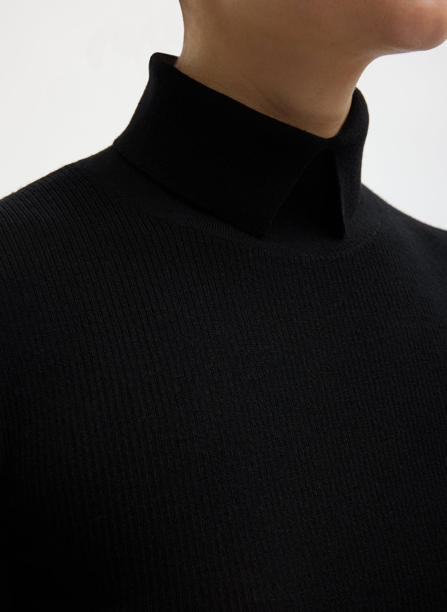 Black Feather Weight Ribbed Split Neck Turtleneck - closeup of split neck detail
