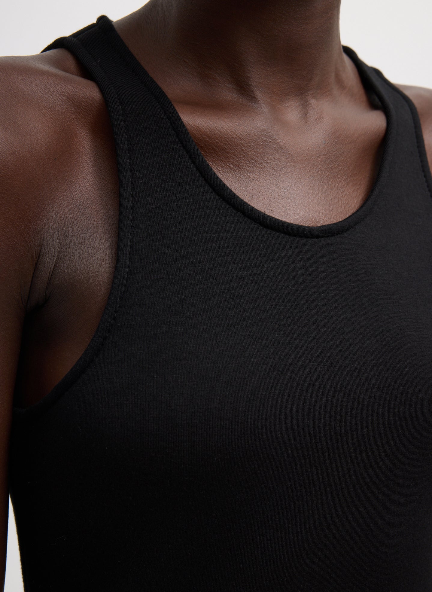 Black Bonded Viscose Sculpted Sleeveless Tunic - closeup of neckline