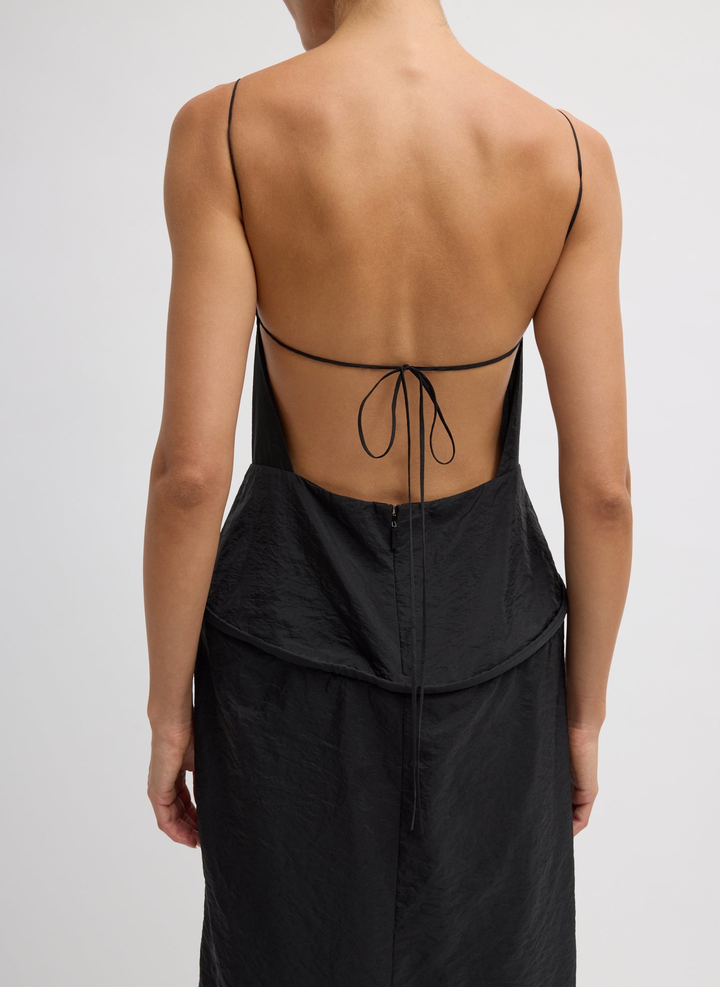 Black Chassis Hoop Strappy Dress - close up of tie back and zip details