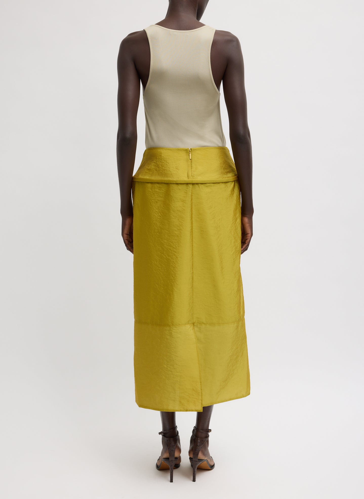 Dijon Chassis Hoop Pencil Skirt - mustard yellow midi skirt with hoop insert at waist, back view on model