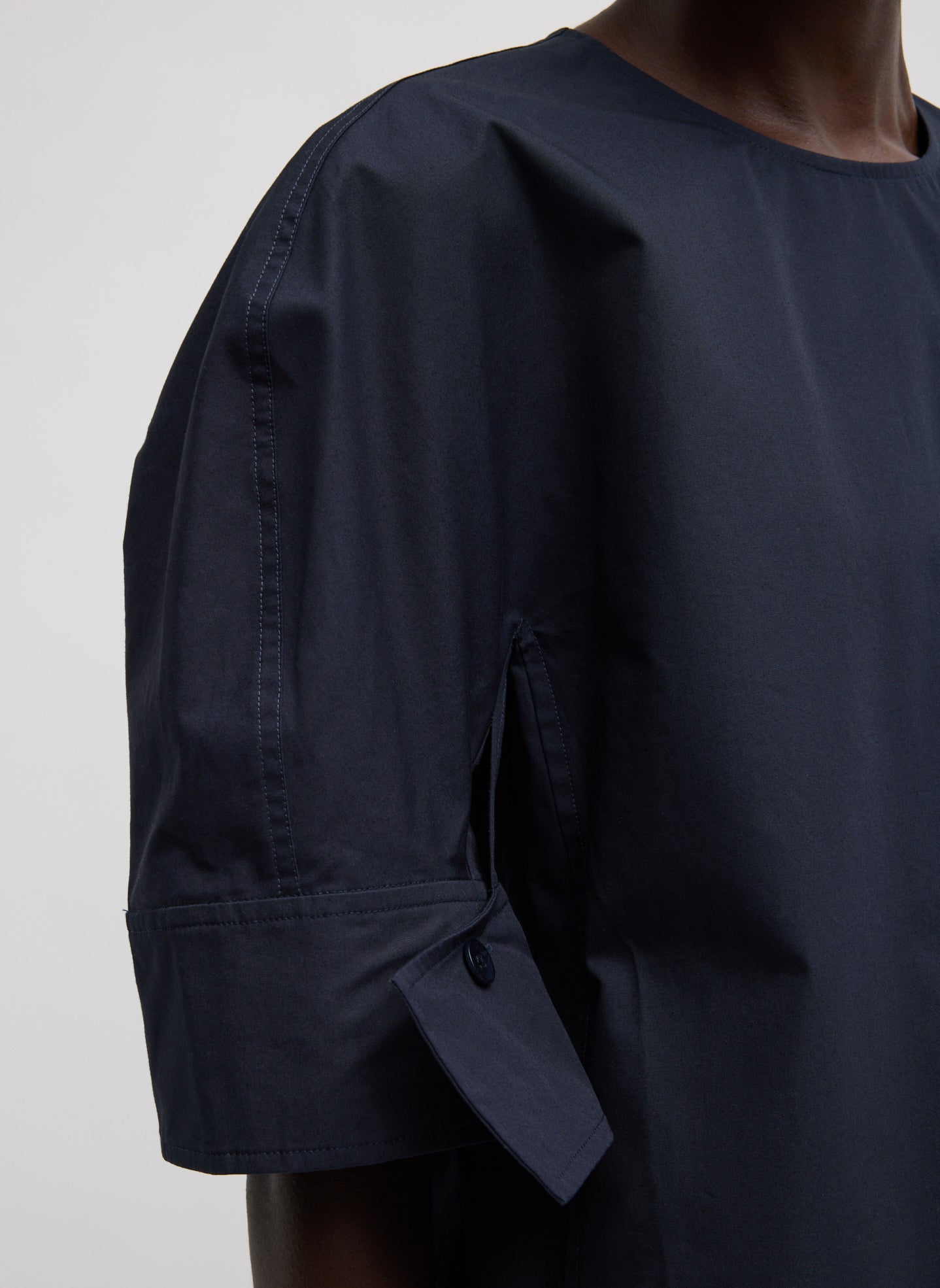 Navy Compact Eco Poplin Reverse Sleeve Top - closeup of sleeve detail