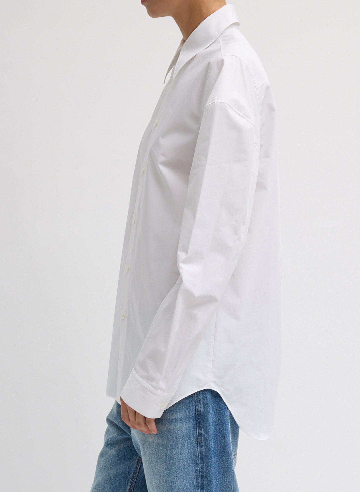 White Compact Eco Poplin Hinged Shirt - long sleeve button down, side view on model