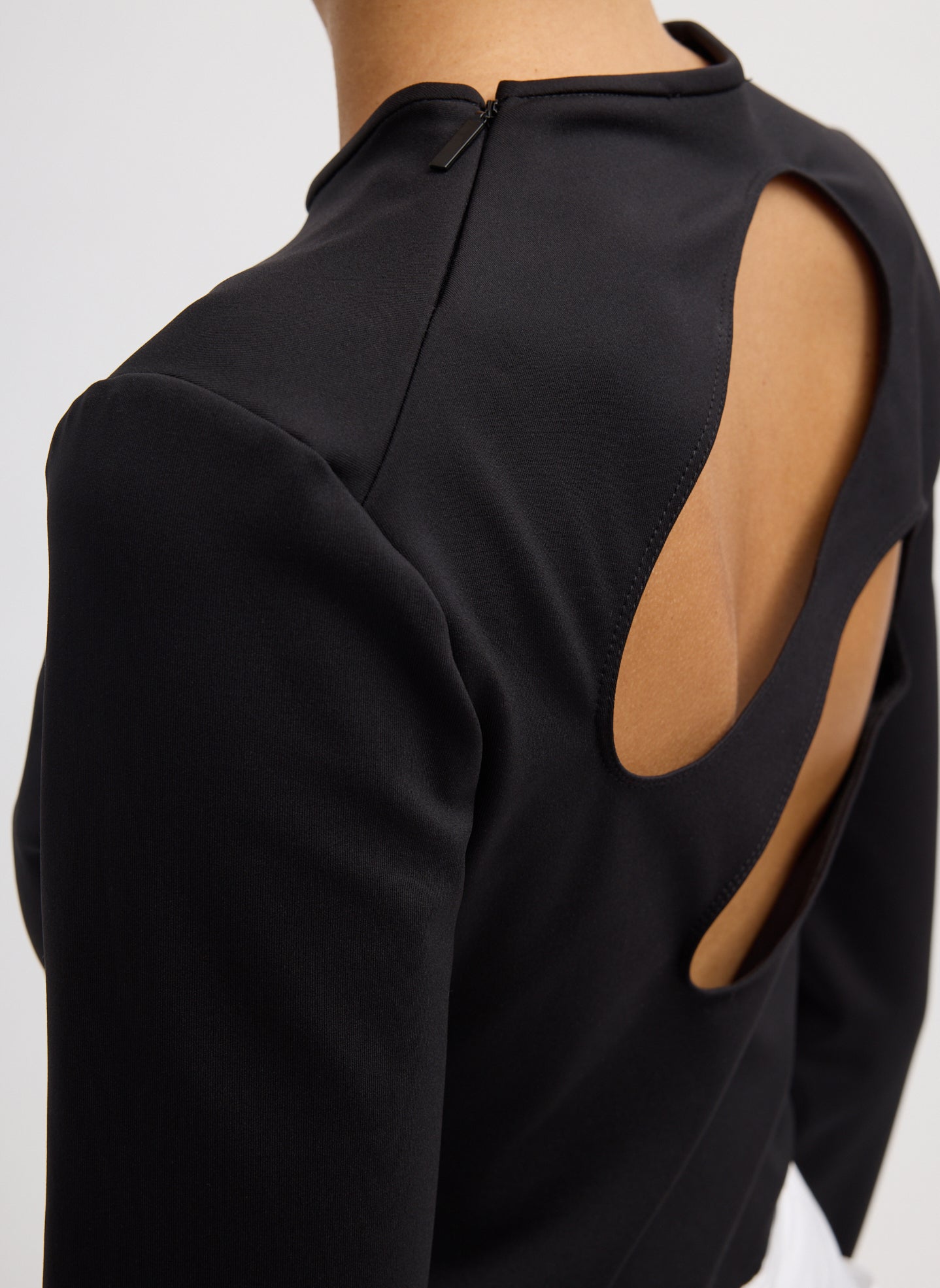 Black Compact Ultra Stretch Cut Out Back Top - closeup of zip detail at back