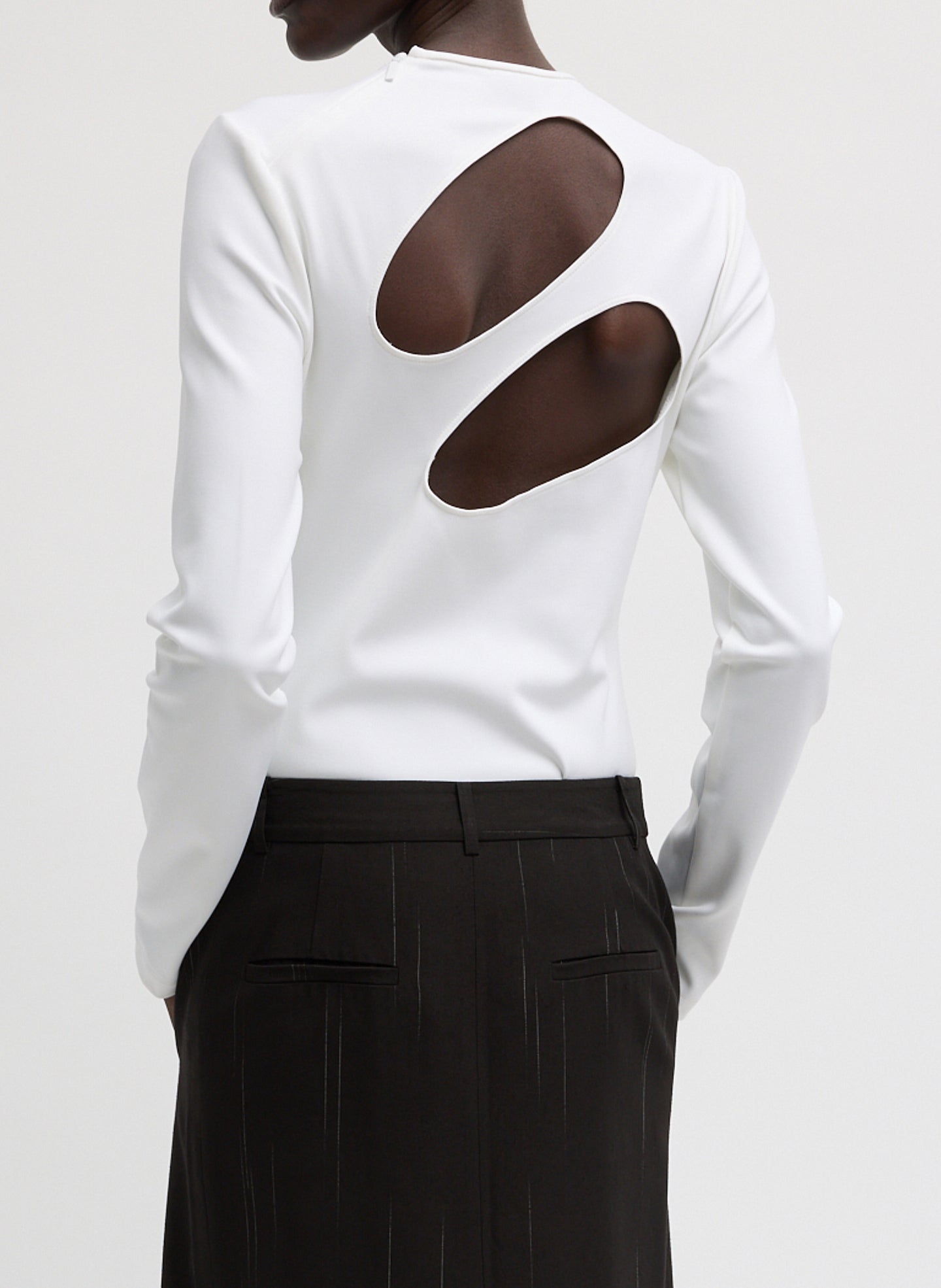 White Compact Ultra Stretch Cut Out Back Top - long sleeve, back view on model