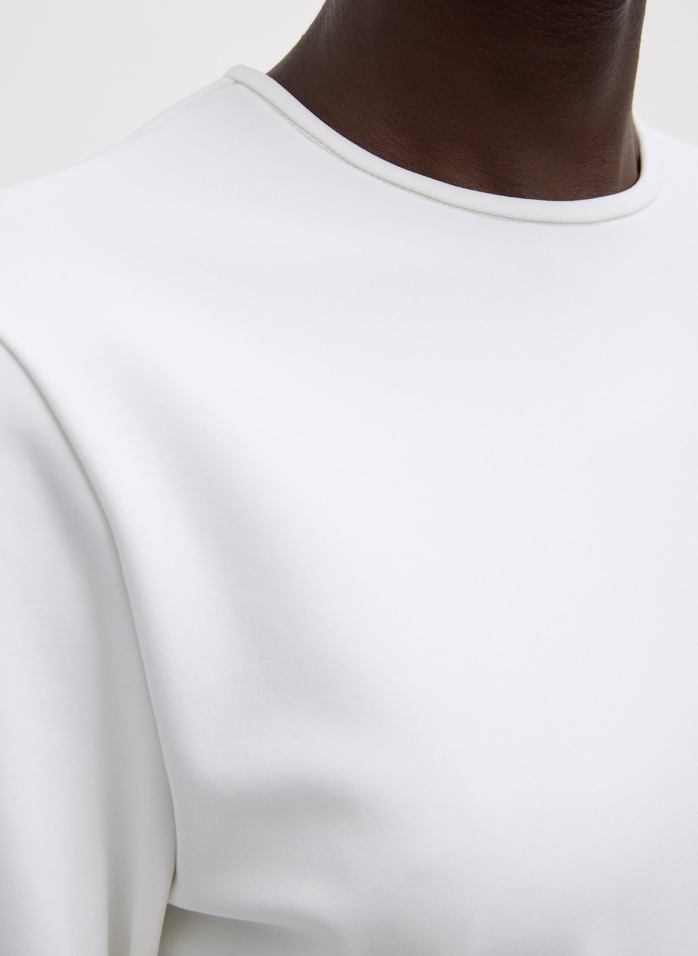 White Compact Ultra Stretch Cut Out Back Top - closeup of neckline