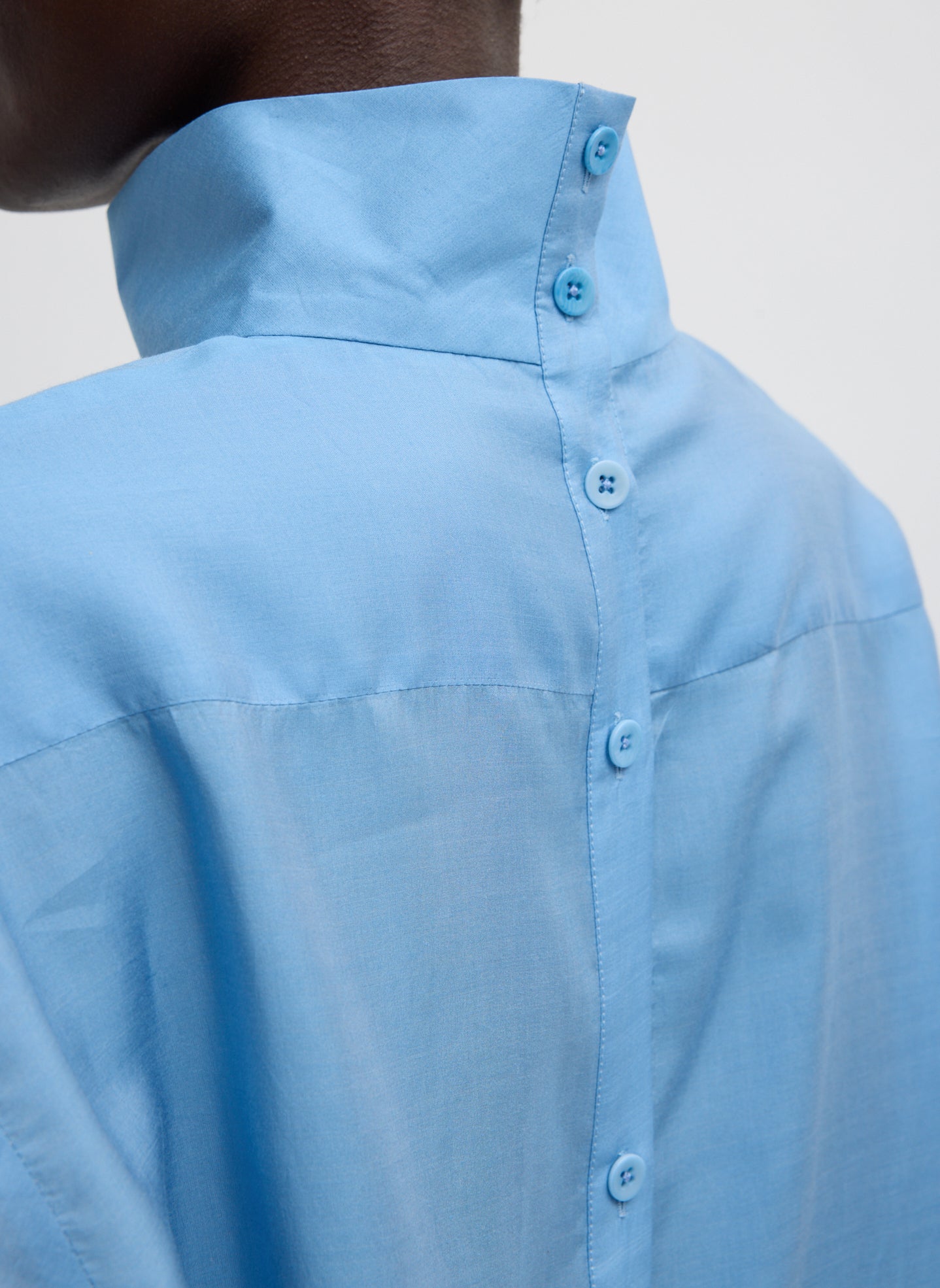 Blue Ultra Light Silk Tencel Funnel Neck Shirt - closeup of buttons at back
