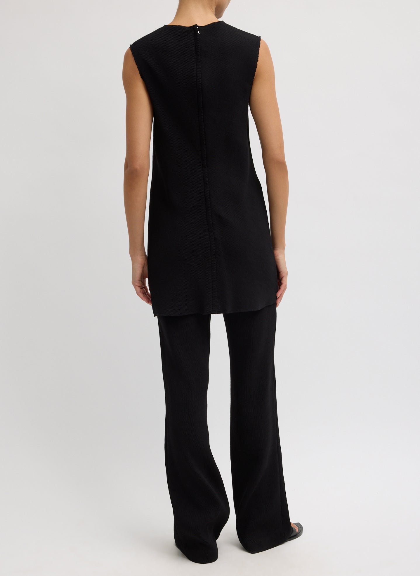 Black Viscose Plisse Sleeveless Bias Short Tunic - back view on model