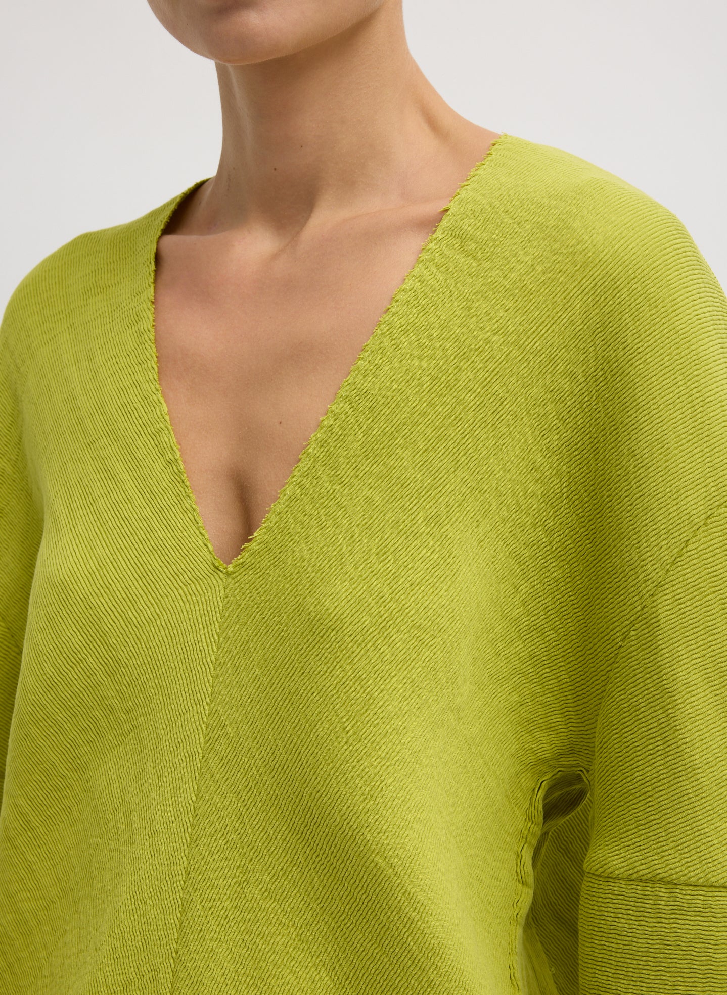 Chartreuse Viscose Plisse Hinged Long Sleeve Top - closeup of neckline