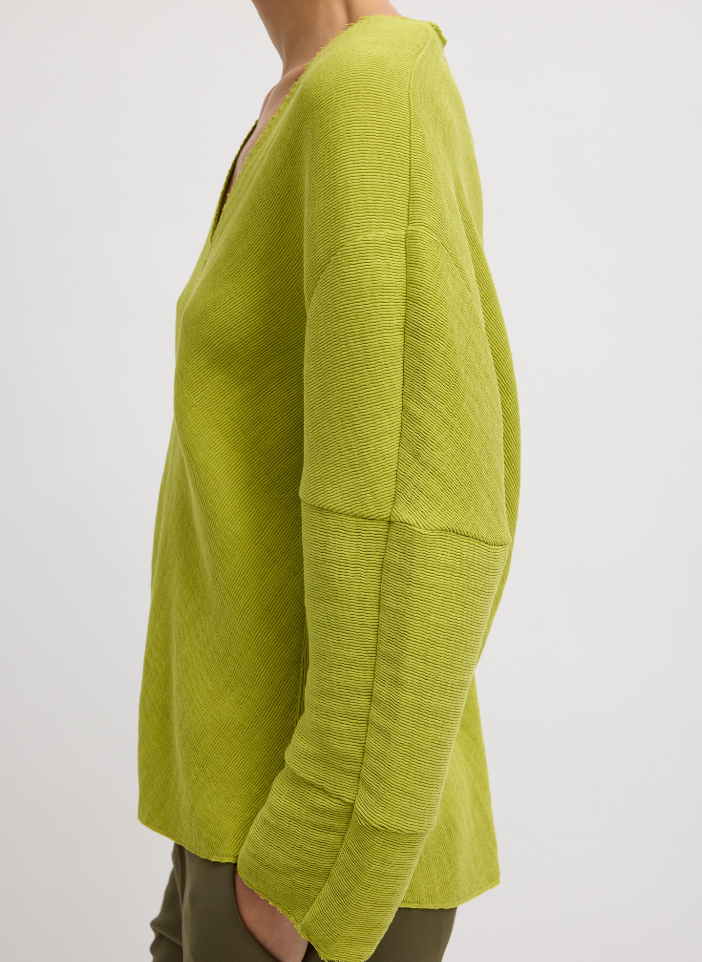 Chartreuse Viscose Plisse Hinged Long Sleeve Top - side view on model