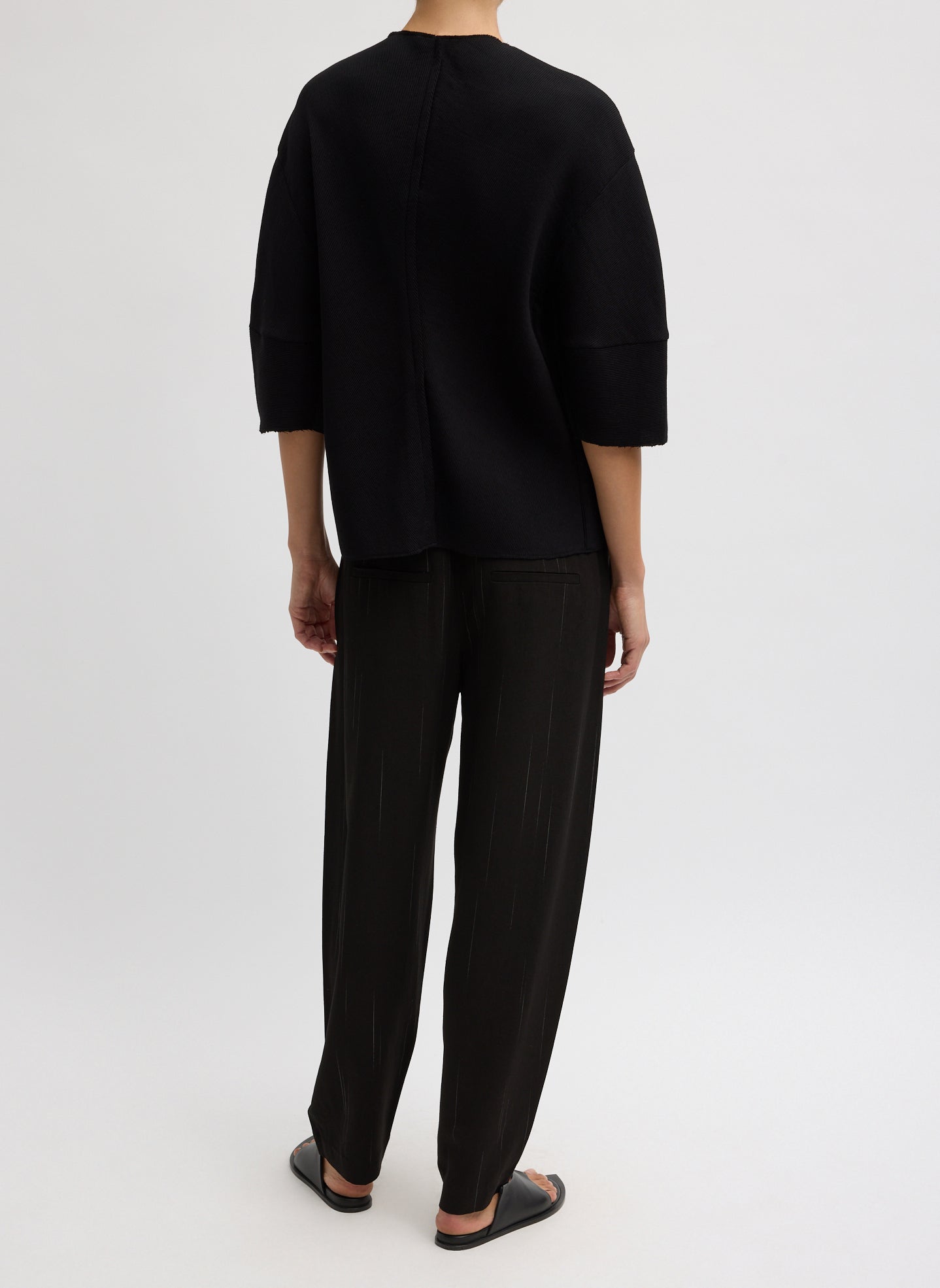 Black Viscose Plisse Hinged Short Sleeve Top - full look, back view on model