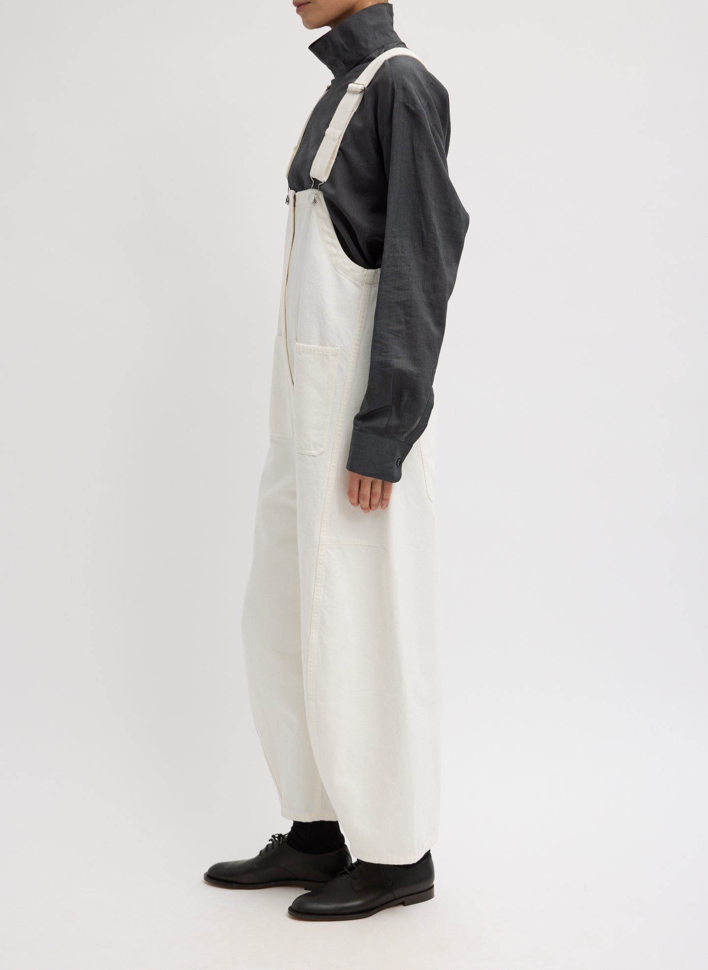 White Denim Jumpsuit - side view on model