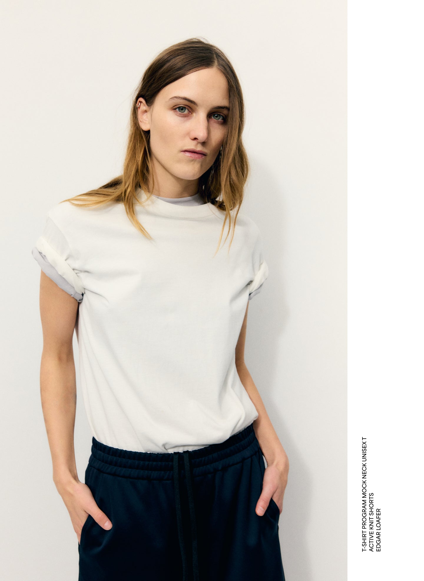 White Mock Neck Unisex T-Shirt - editorial image on model