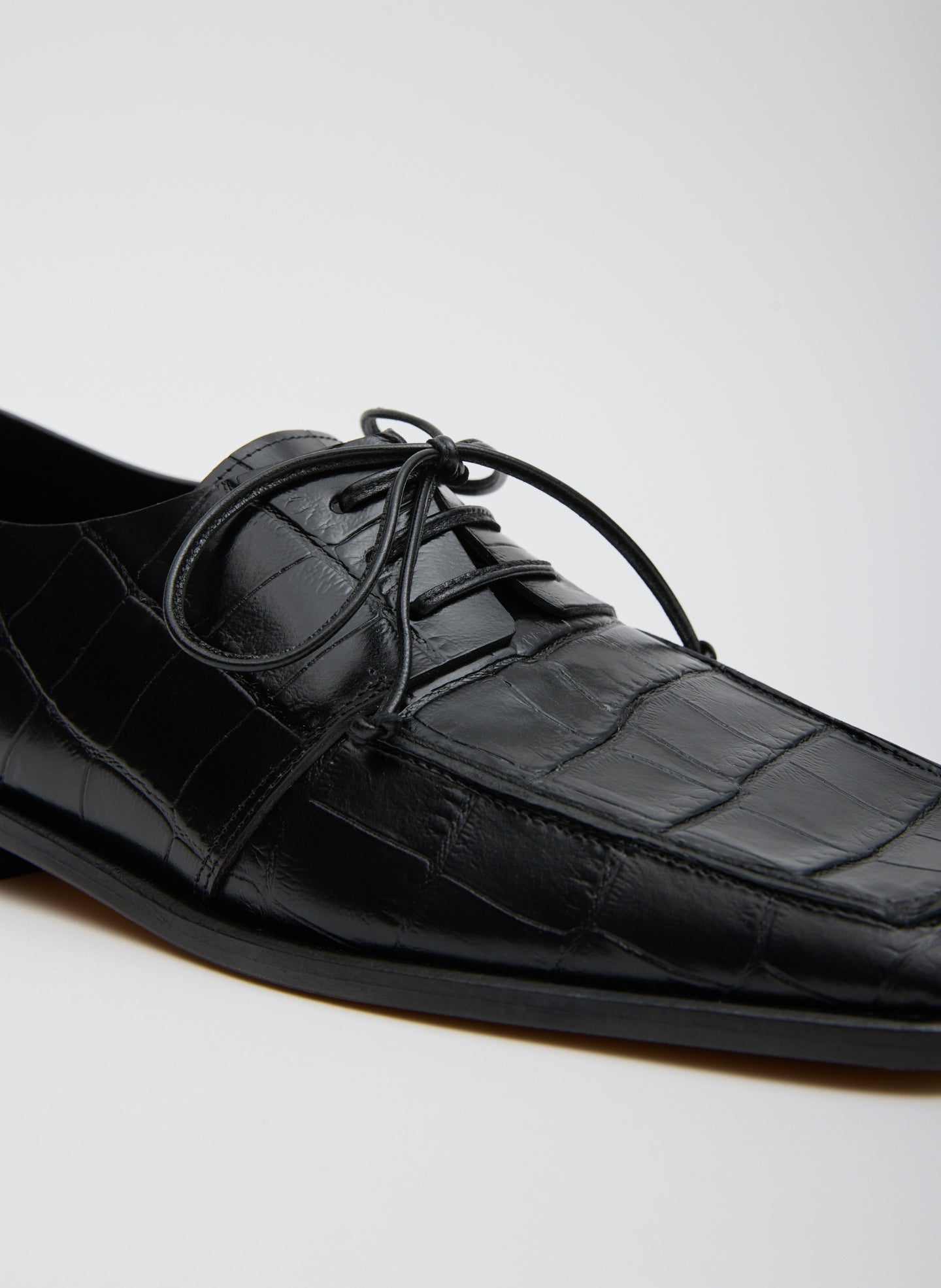 Black Brody Square Toe Loafer Crocodile Embossed - closeup of crocodile embossed leather