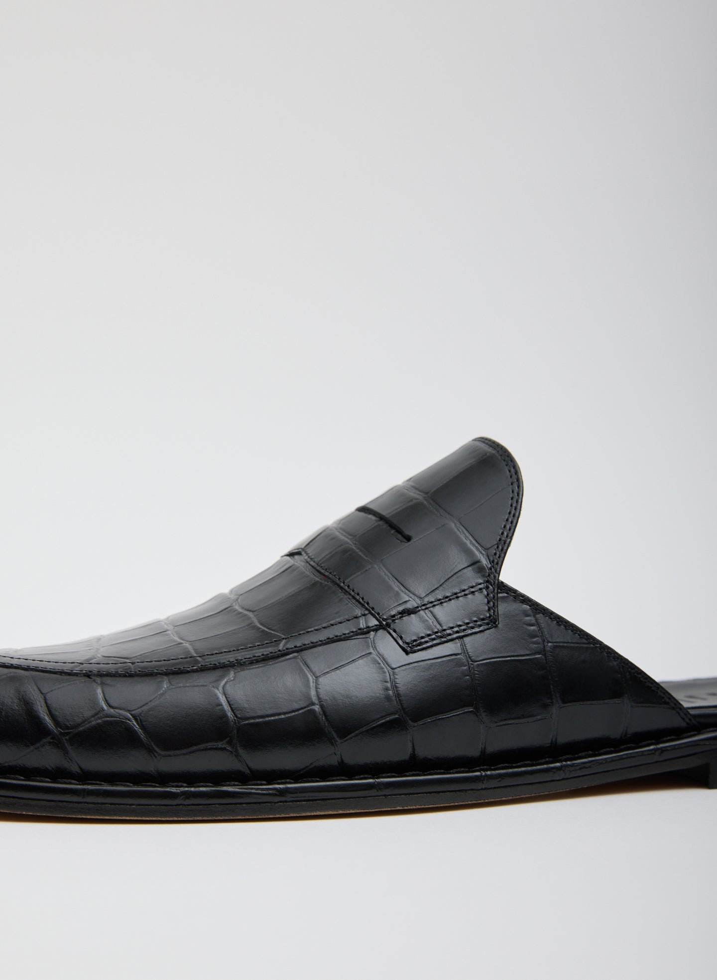 Black Herbert Slide Crocodile Embossed - closeup of embossed leather