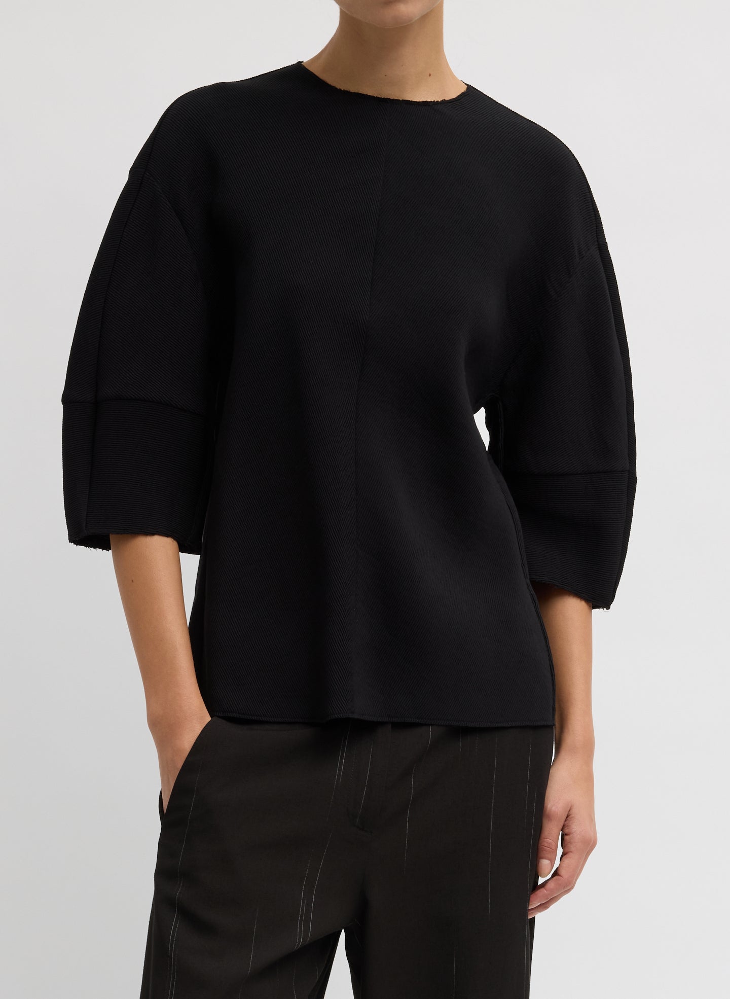 Black Viscose Plisse Hinged Short Sleeve Top - front view on model