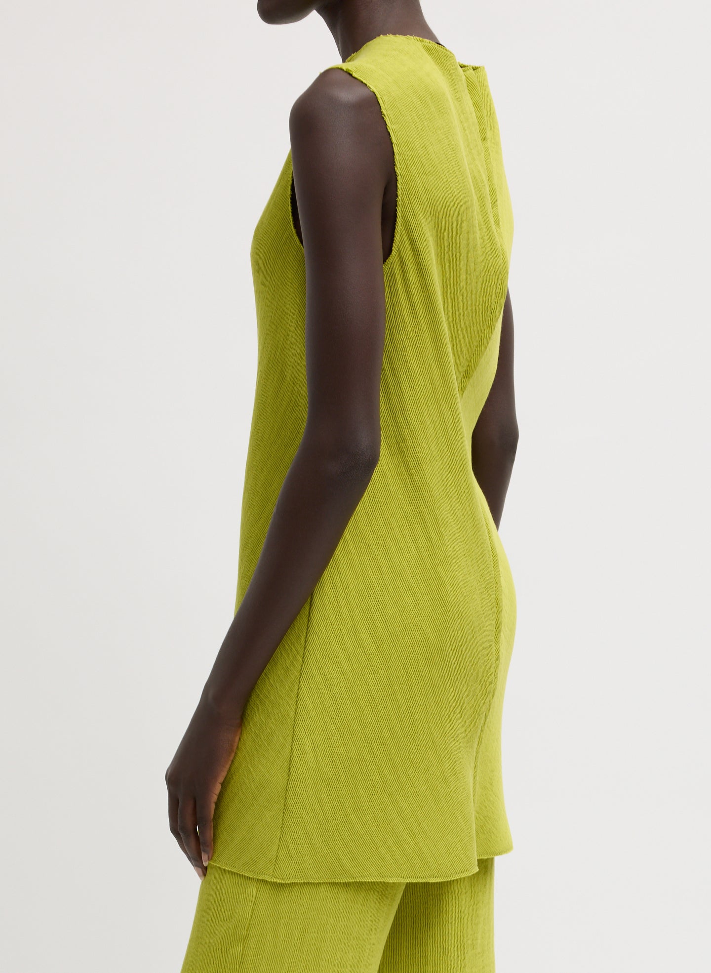Chartreuse Viscose Plisse Sleeveless Bias Short Tunic - side view on model