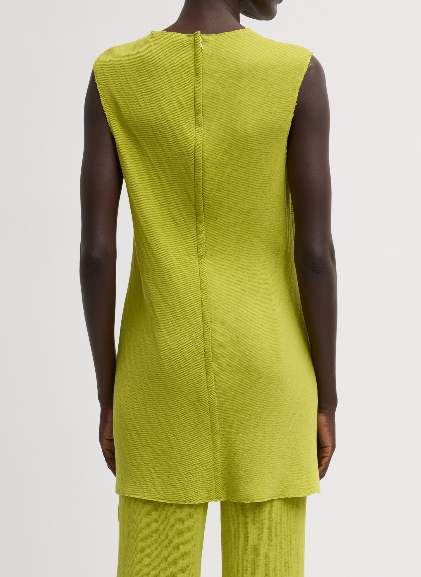 Chartreuse Viscose Plisse Sleeveless Bias Short Tunic - back view on model