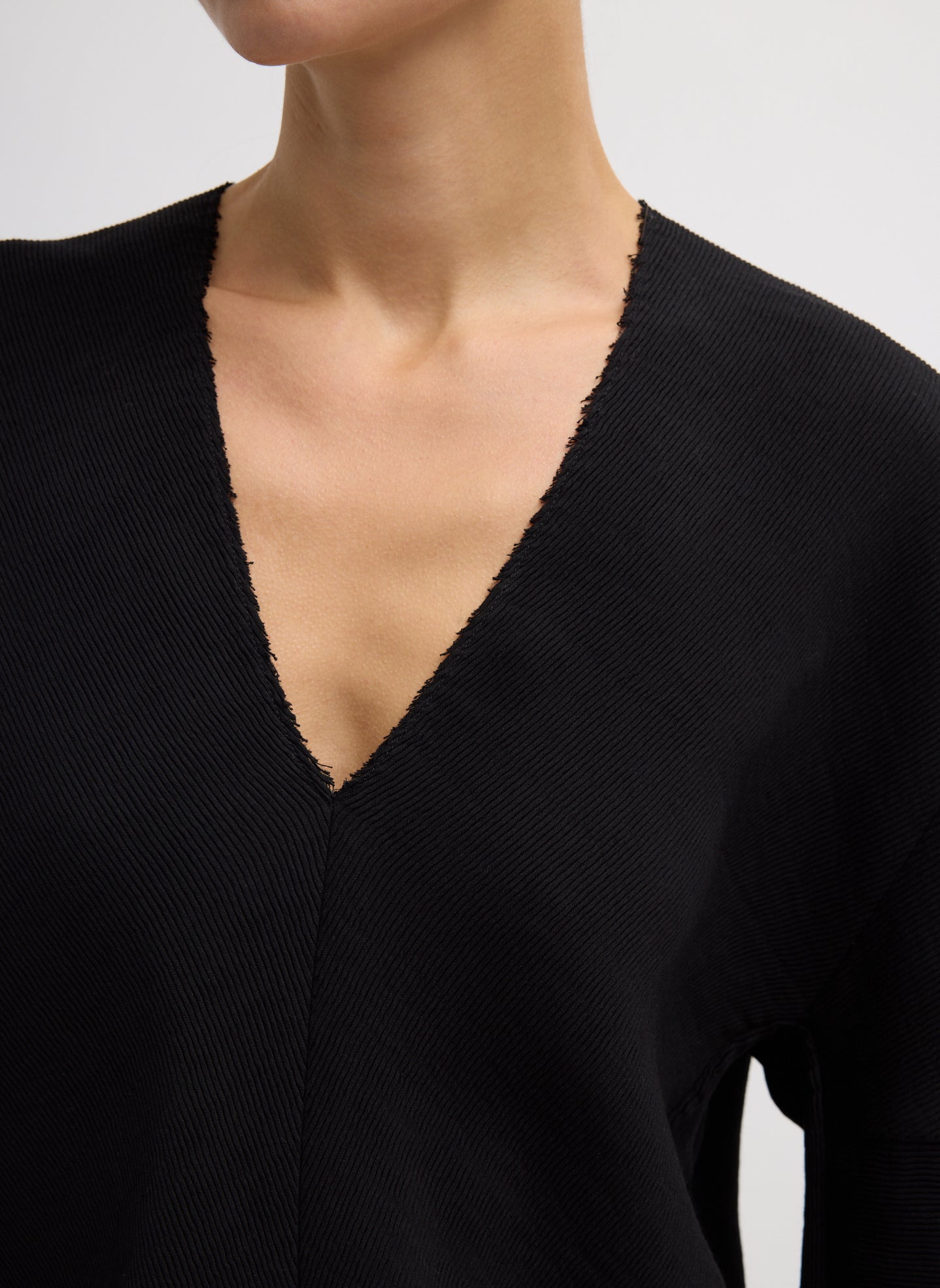 Black Viscose Plisse Hinged Long Sleeve Top - closeup of neckline