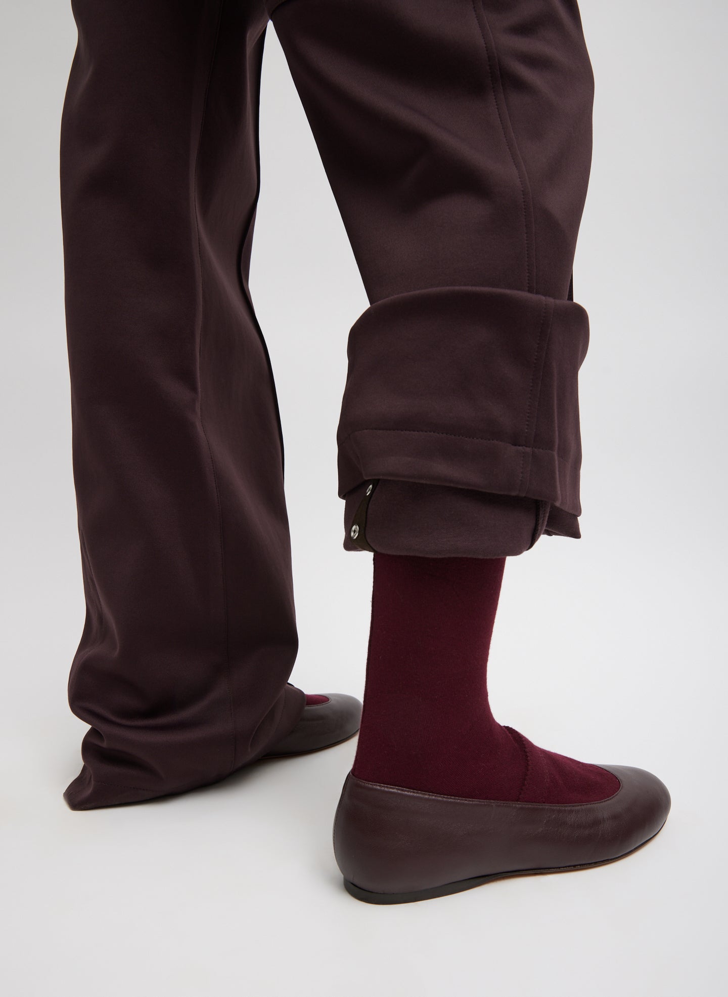 Brown Active Knit Scottie Jogger - closeup of adjustable snap detail at pant hem