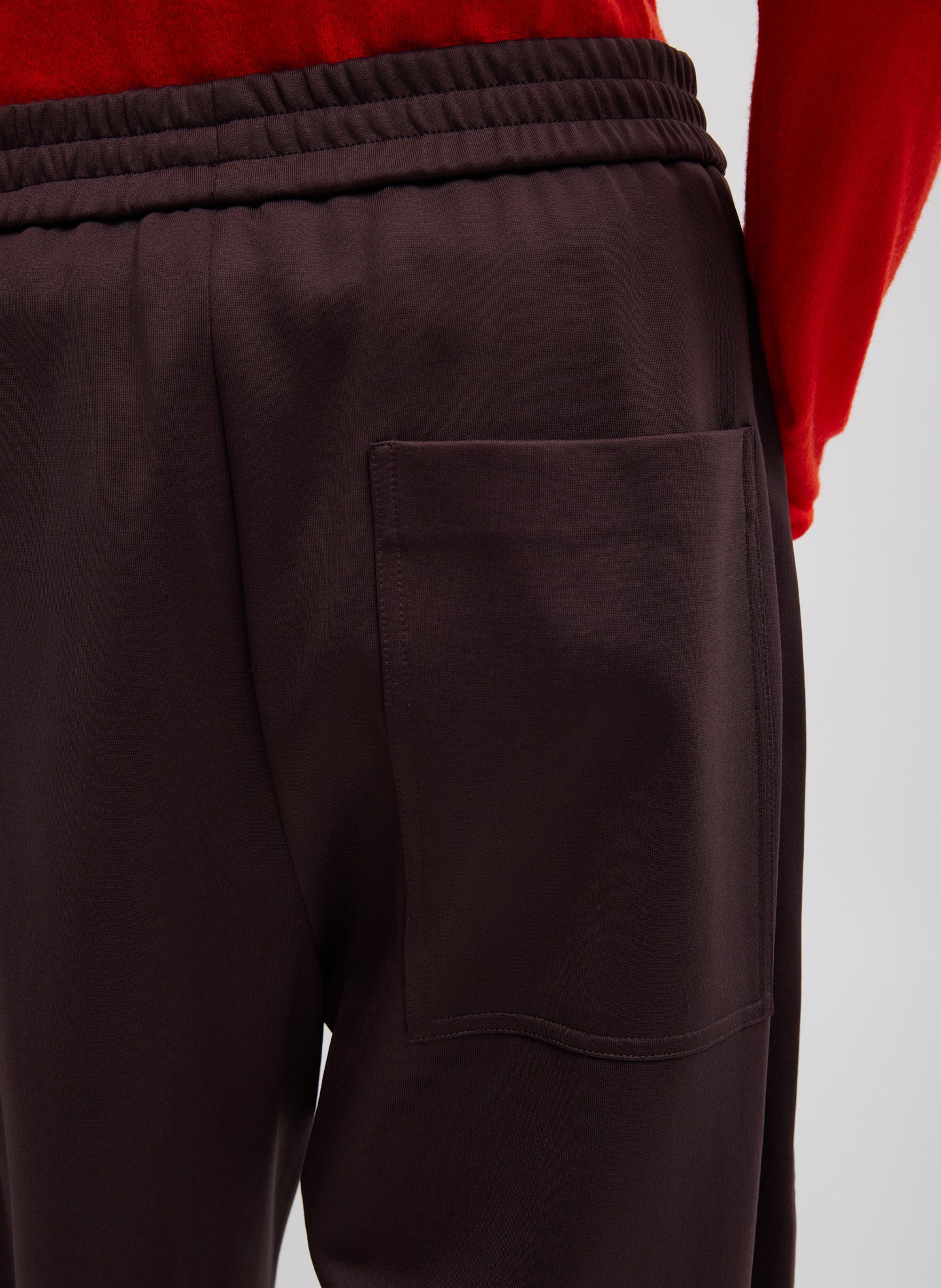 Brown Active Knit Winslow Pant - closeup of back pocket detail