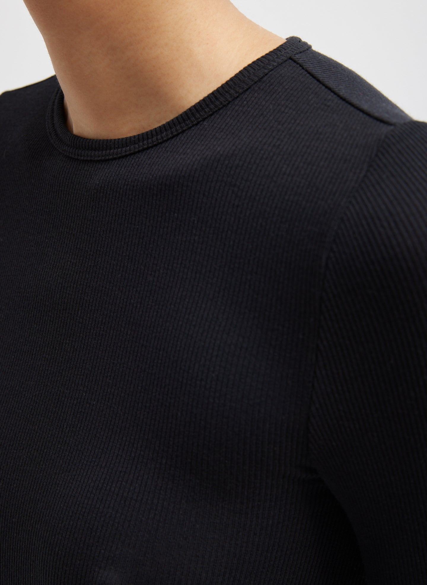Black Circular Ribbed Crewneck Long Sleeve T-Shirt - closeup of neckline and ribbed fabric