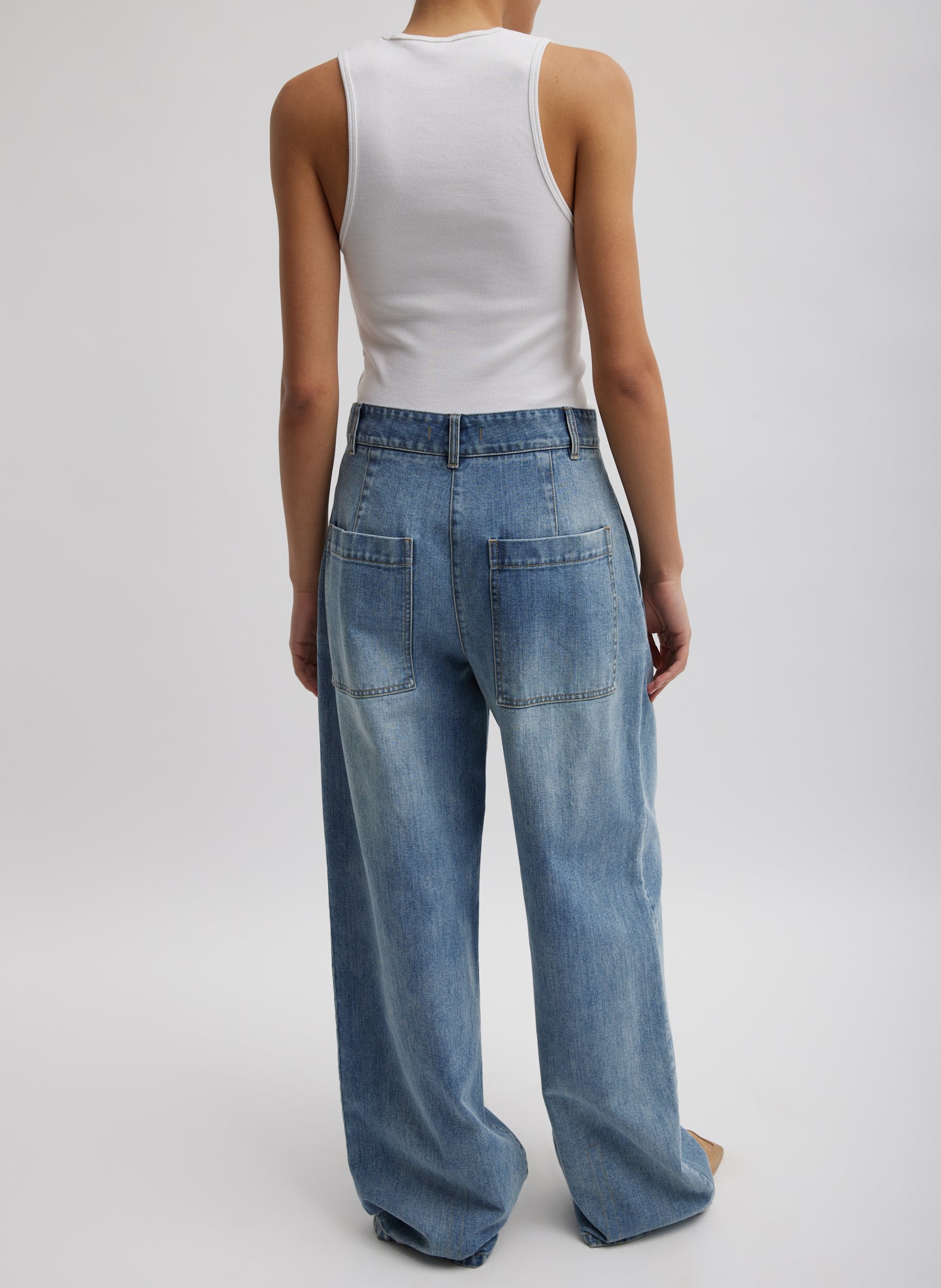 Blue Classic Wash Stella Jean - pleated denim, back view on model