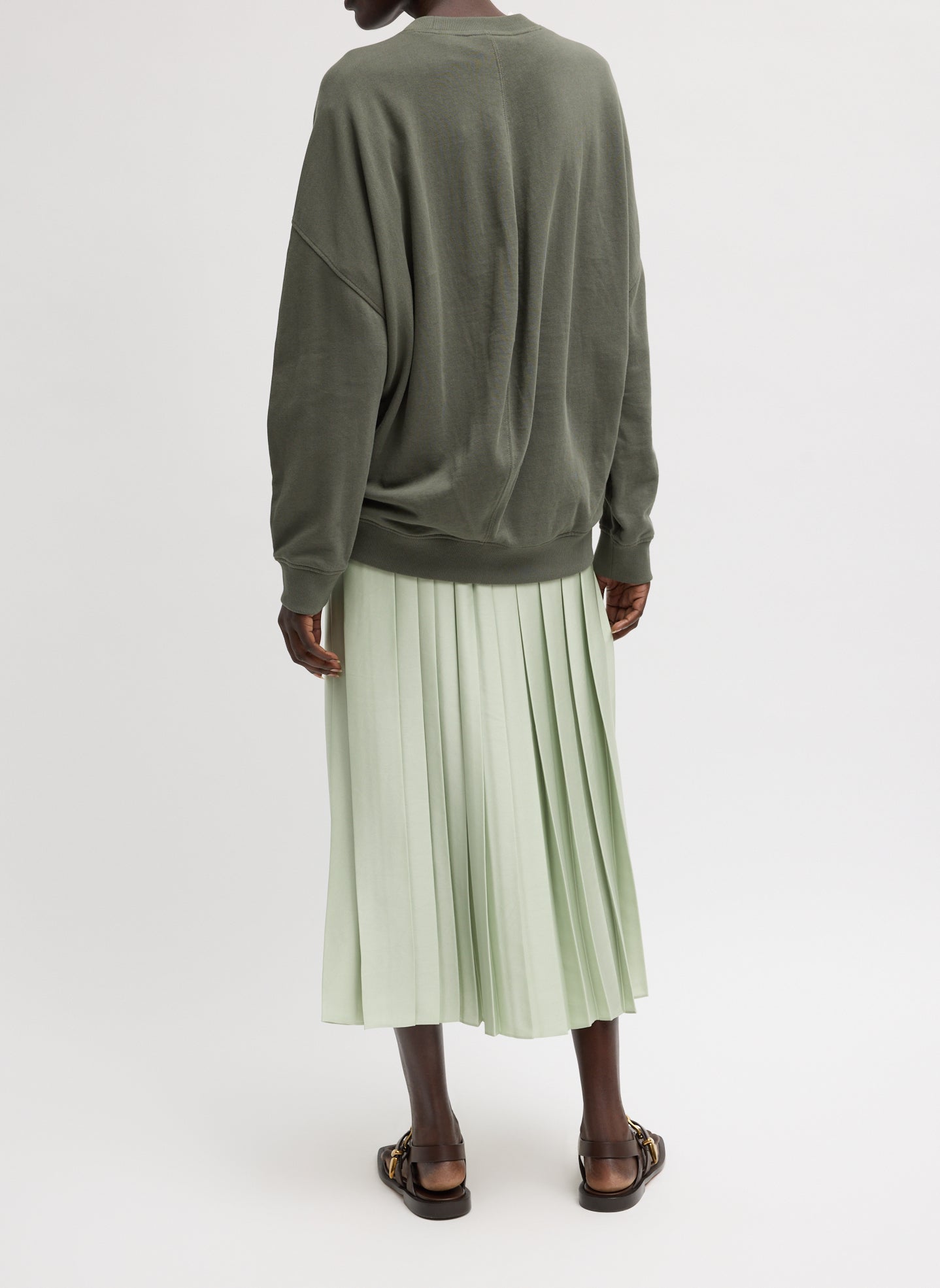 Sage Green Feather Weight Pleated Pull on Skirt - pleated midi skirt, back view on model