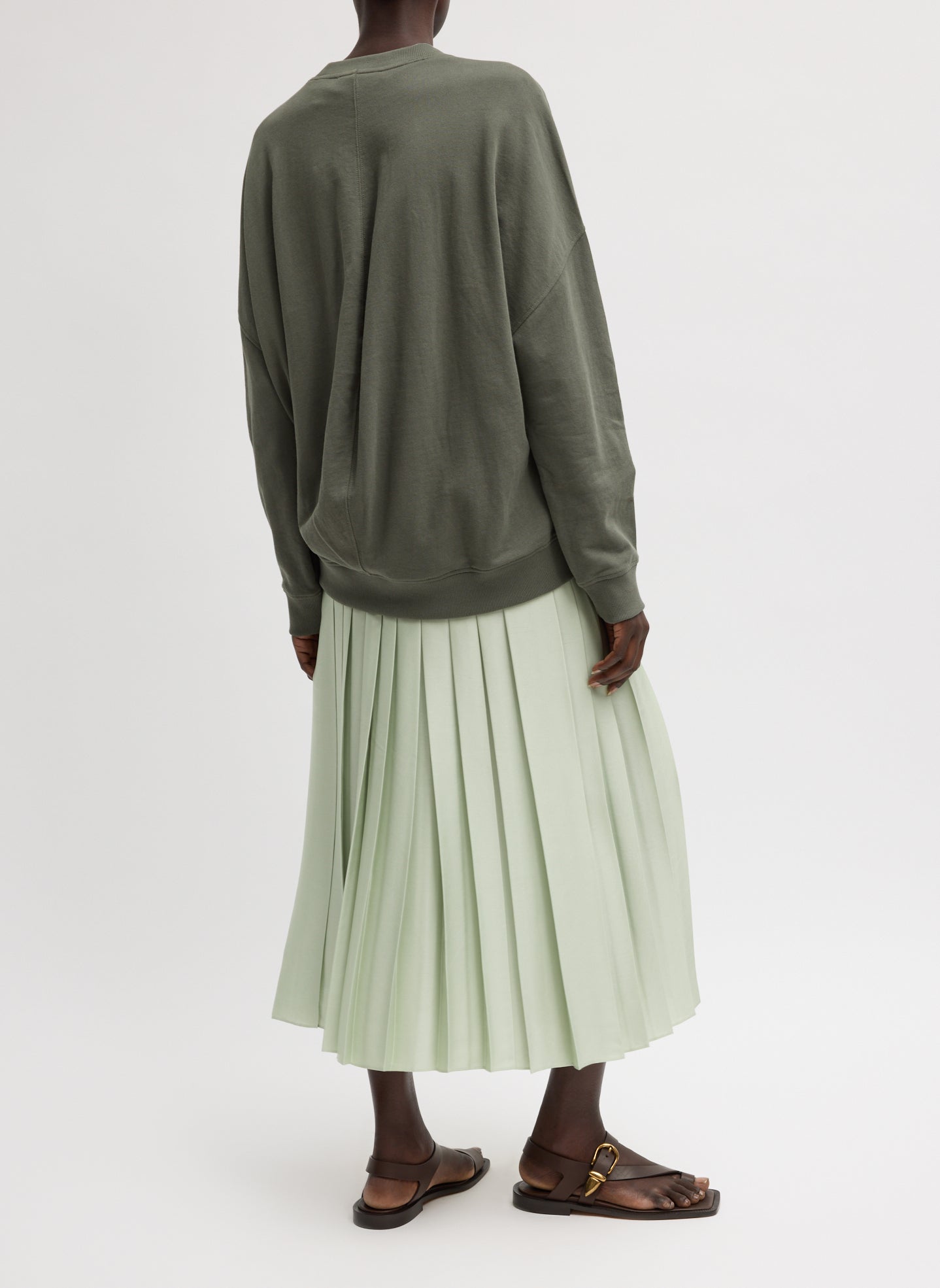 Sage Green Feather Weight Pleated Pull on Skirt - pleated midi skirt, side view on model