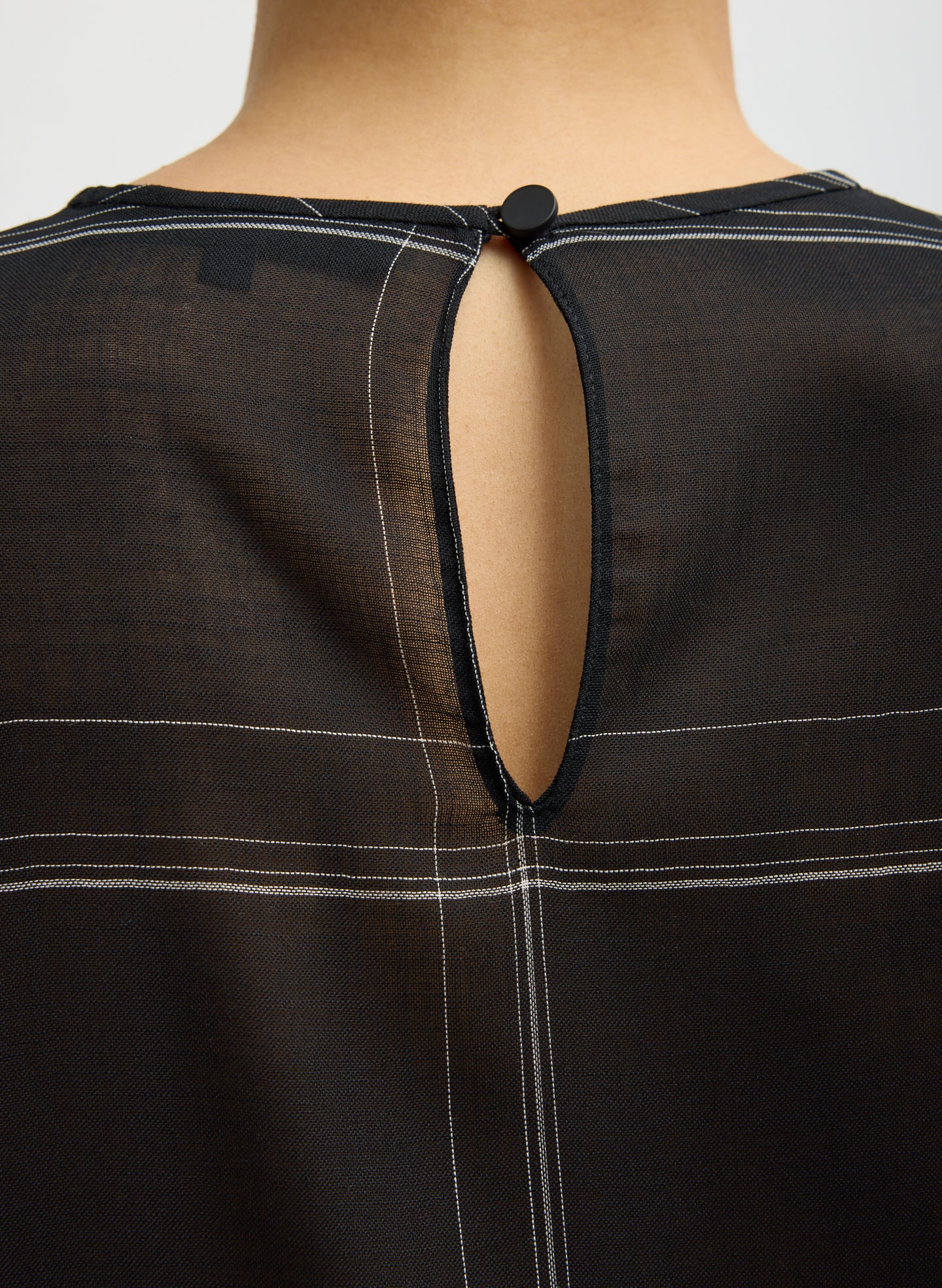 Black Checked Sheer Wool Gauze Easy T-Shirt - closeup of button closure at back