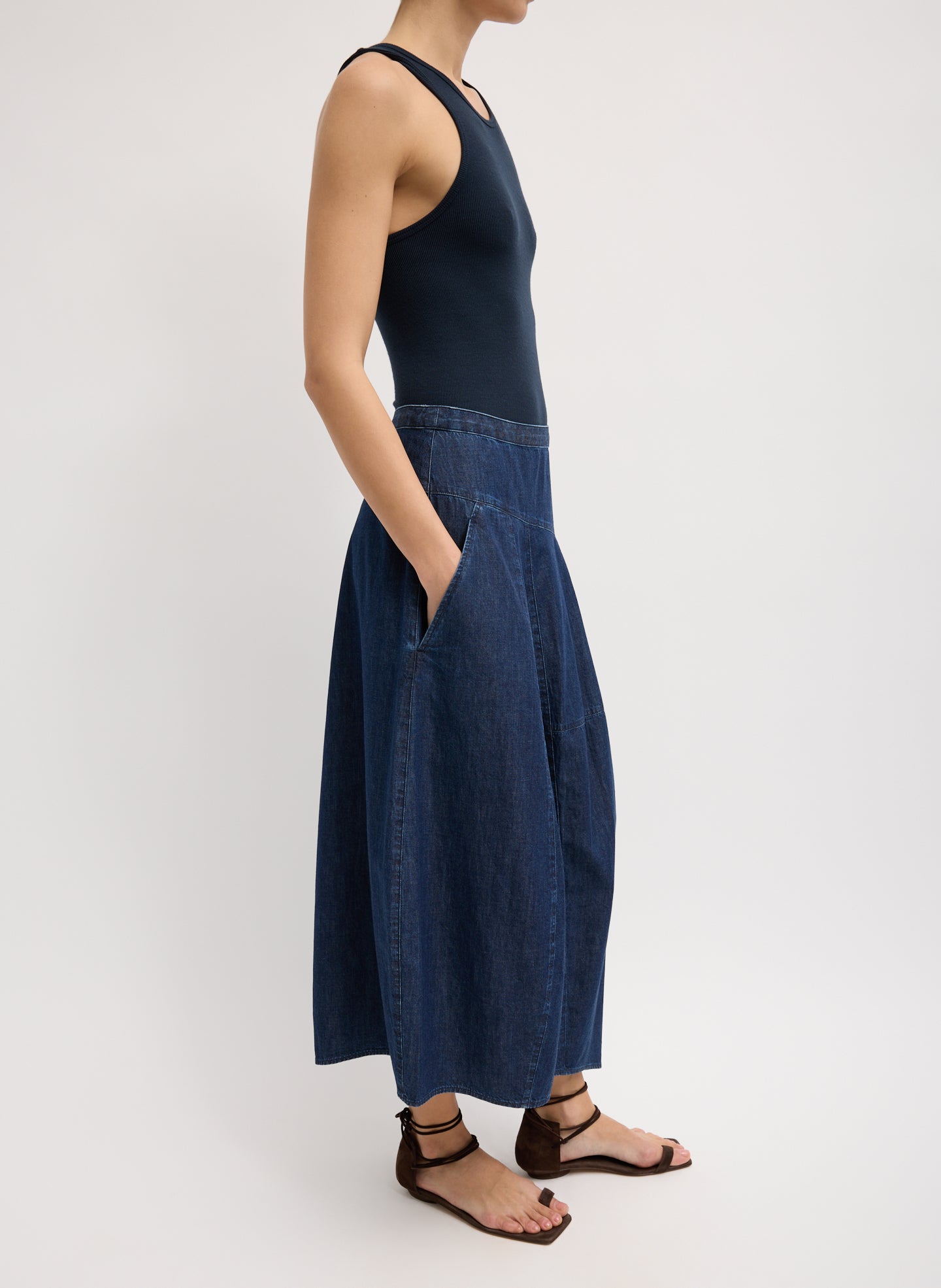 Light Weight Indigo Denim Asymmetrical Balloon Skirt - dark wash, side view on model