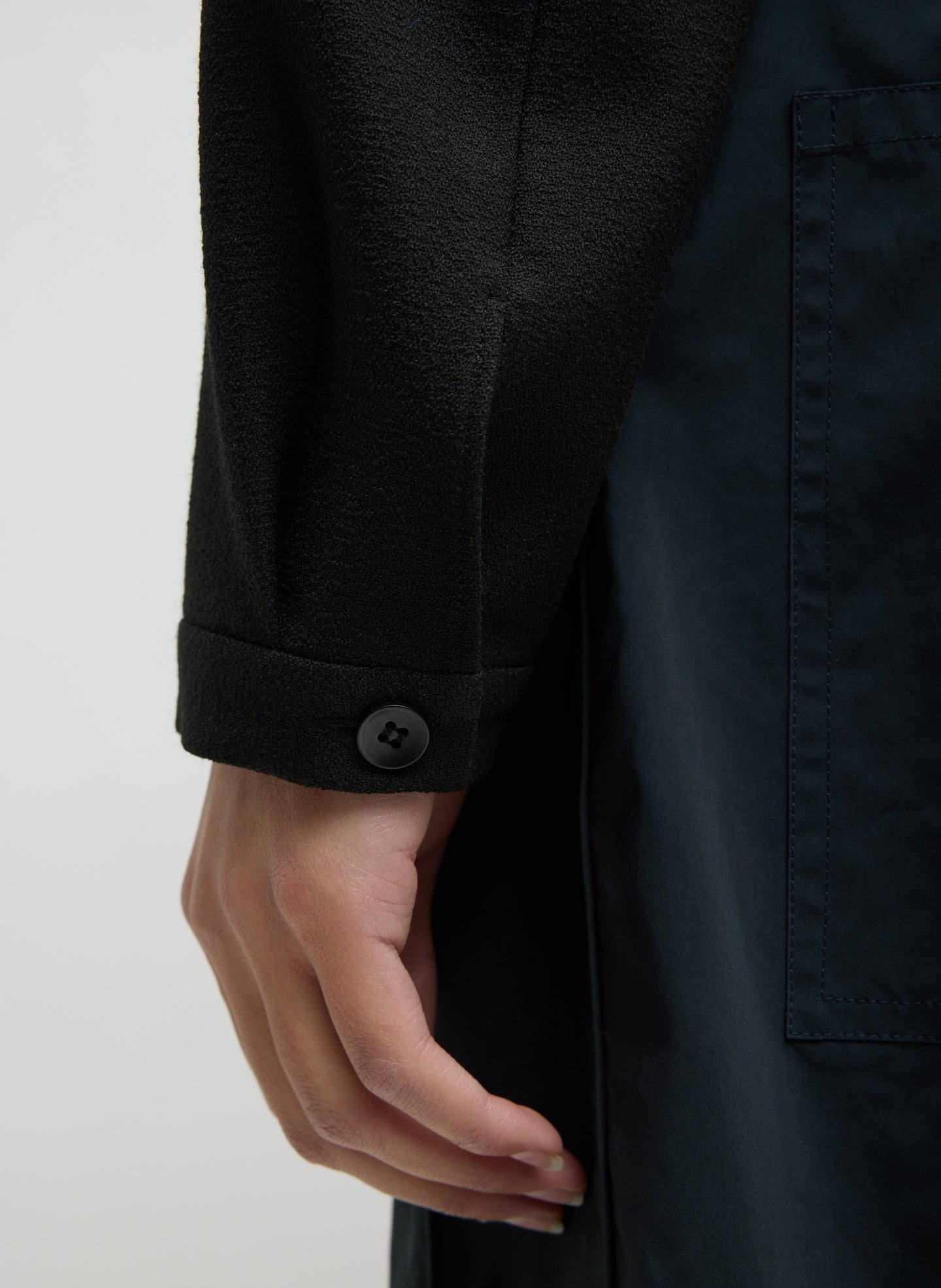 Black Mica Crepe V-Neck Top - closeup of button detail at sleeve