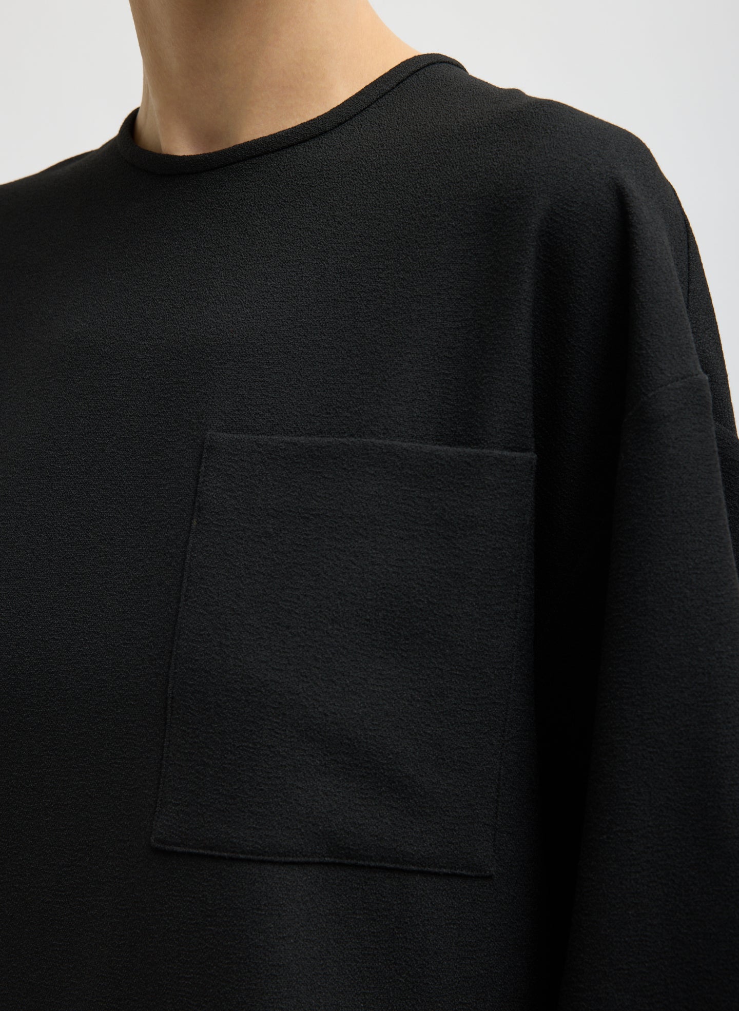 Black Mica Crepe Easy T-Shirt - closeup of front pocket detail