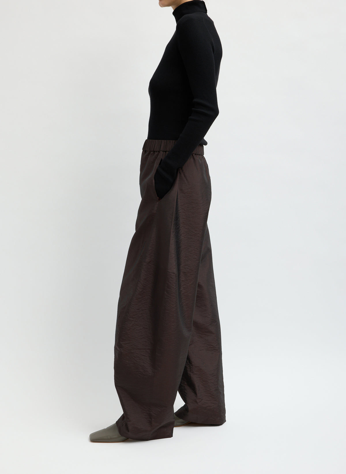 Dark Brown Crispy Nylon Winslow Pant - barrel leg pull on pant, side view on model