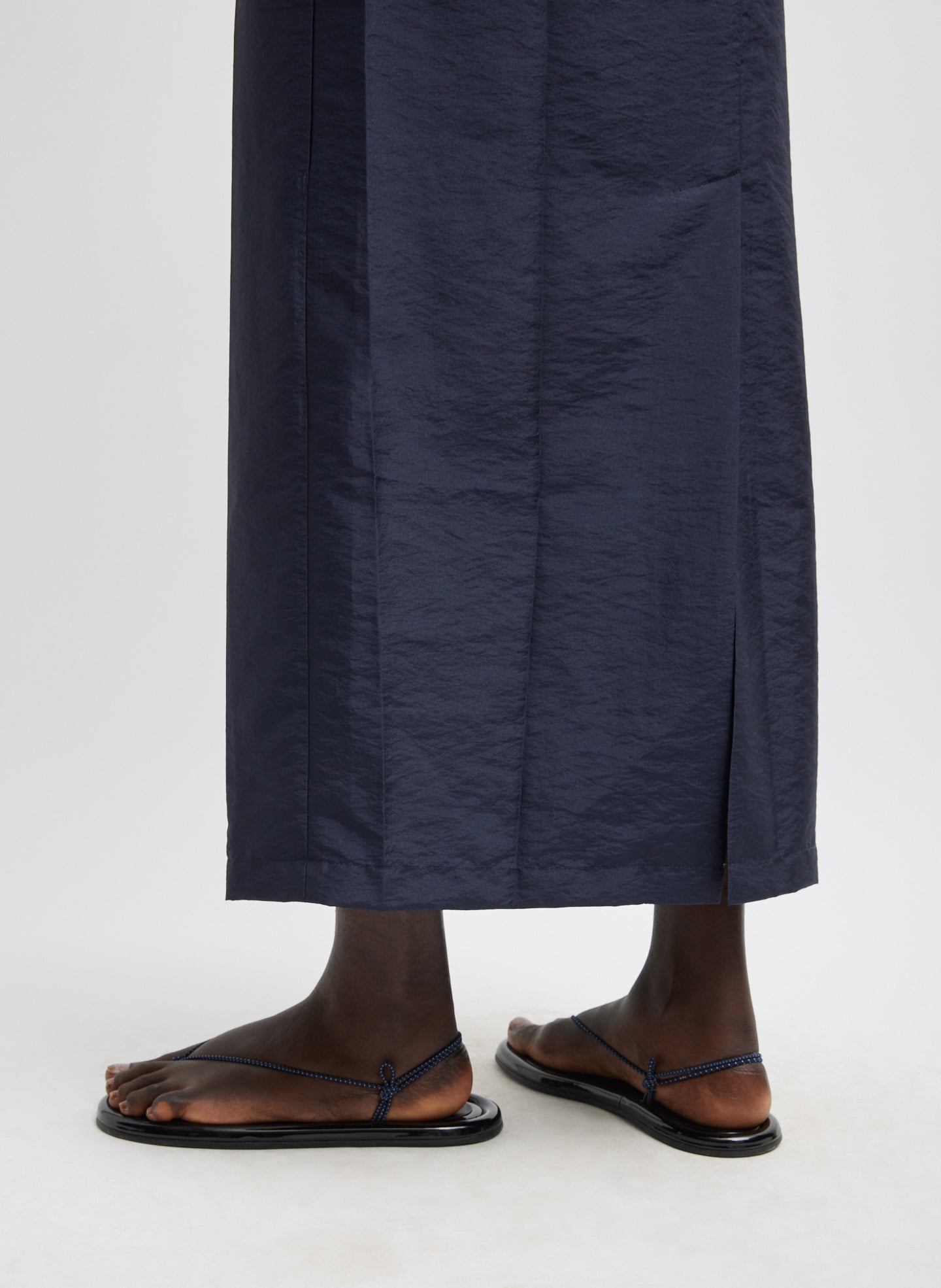 Navy Crispy Nylon Maxi Skirt - close up of vent detail at hem