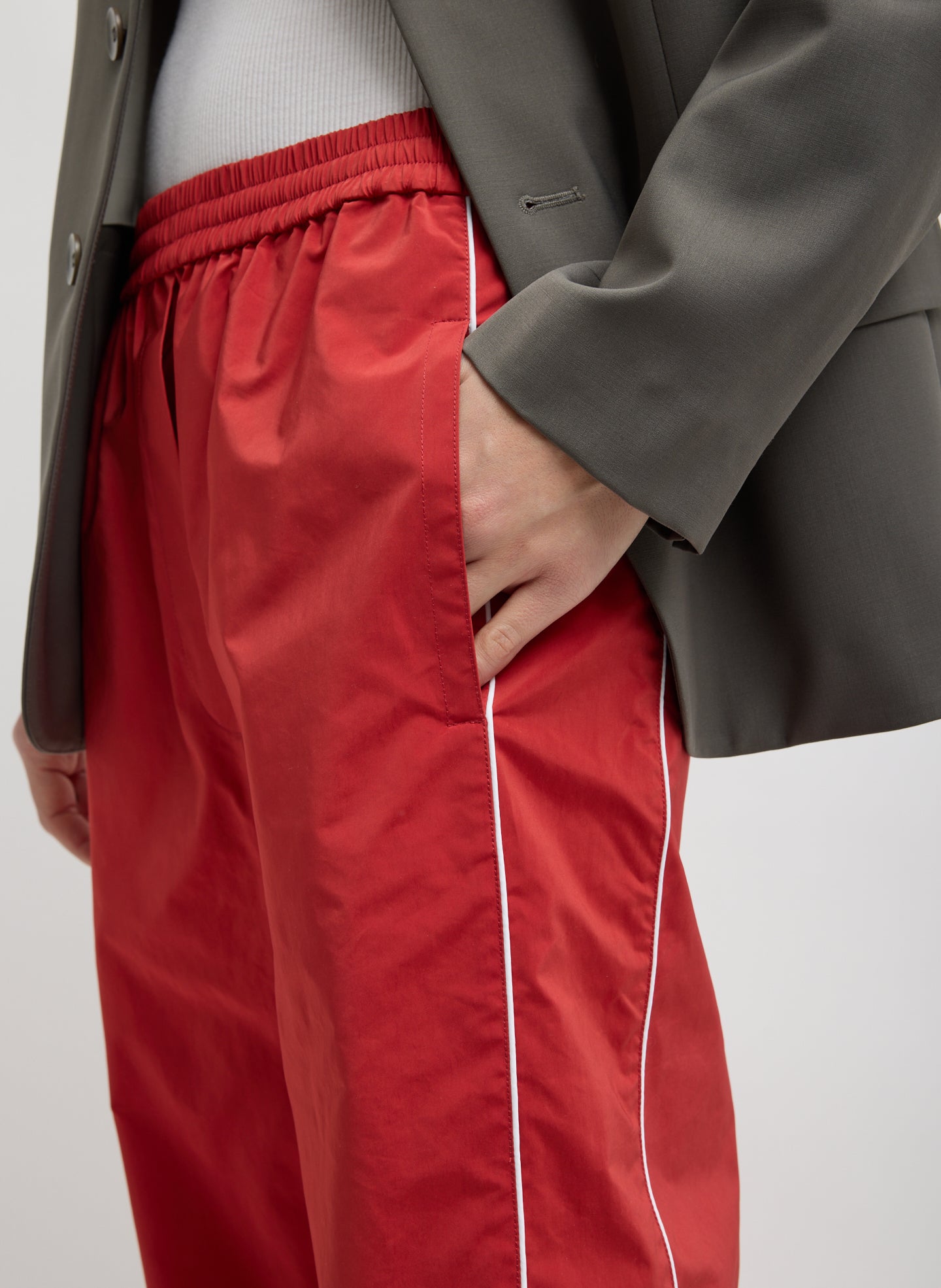 Red Nylon Piped Jogger - closeup of side pocket detail