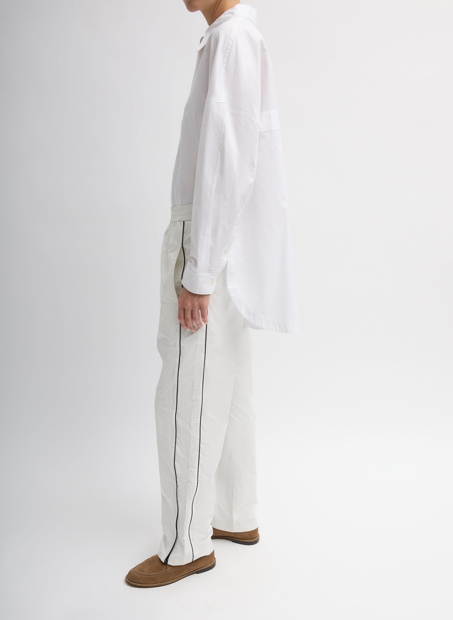 White Nylon Piped Jogger - pull on jogger, side view on model