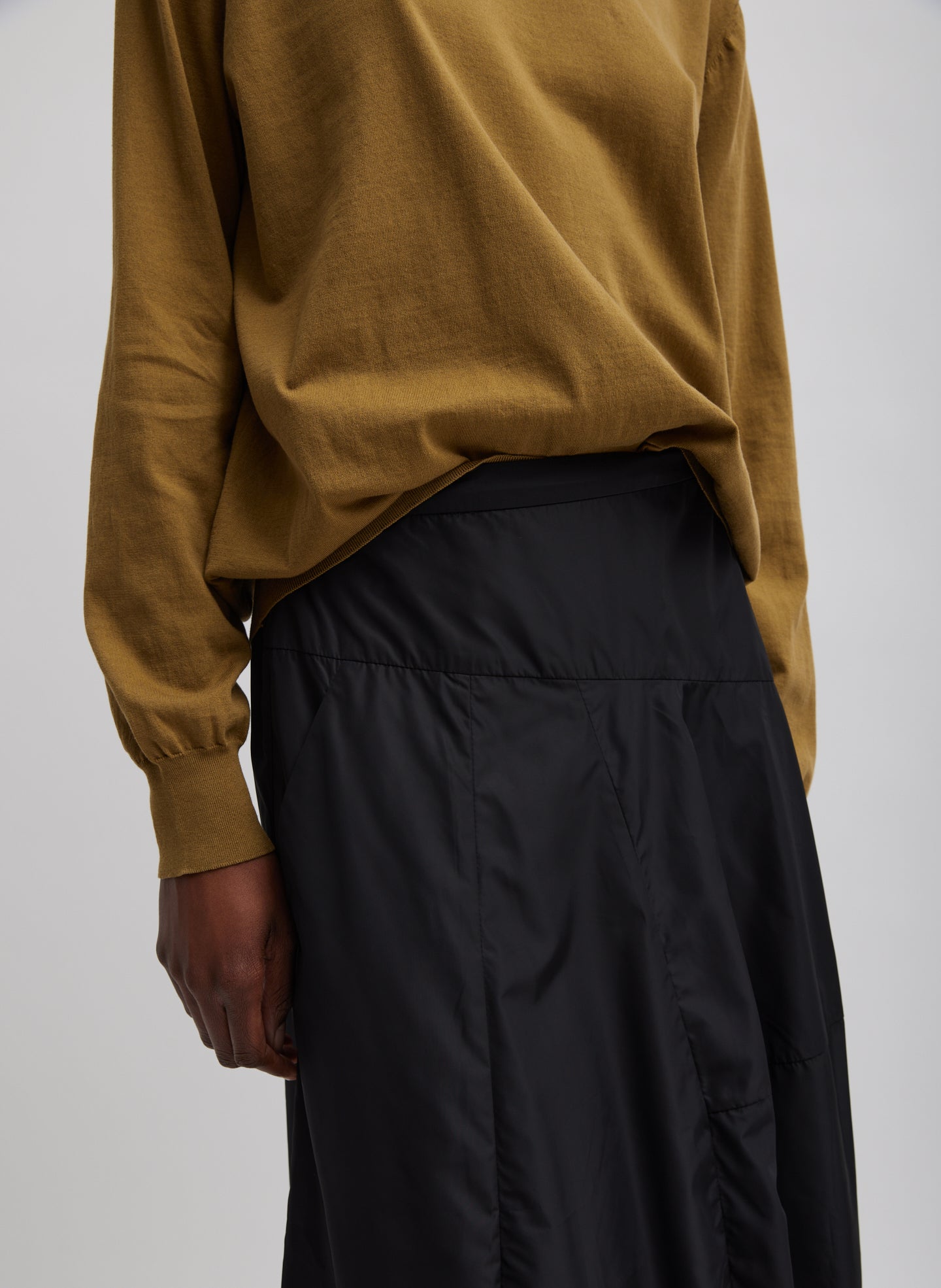 Black Nylon Asymmetrical Balloon Skirt - closeup of asymmetrical seam details