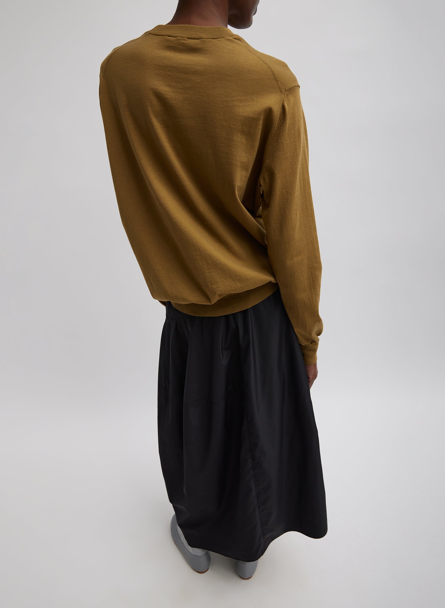 Black Nylon Asymmetrical Balloon Skirt - midi skirt, back view on model