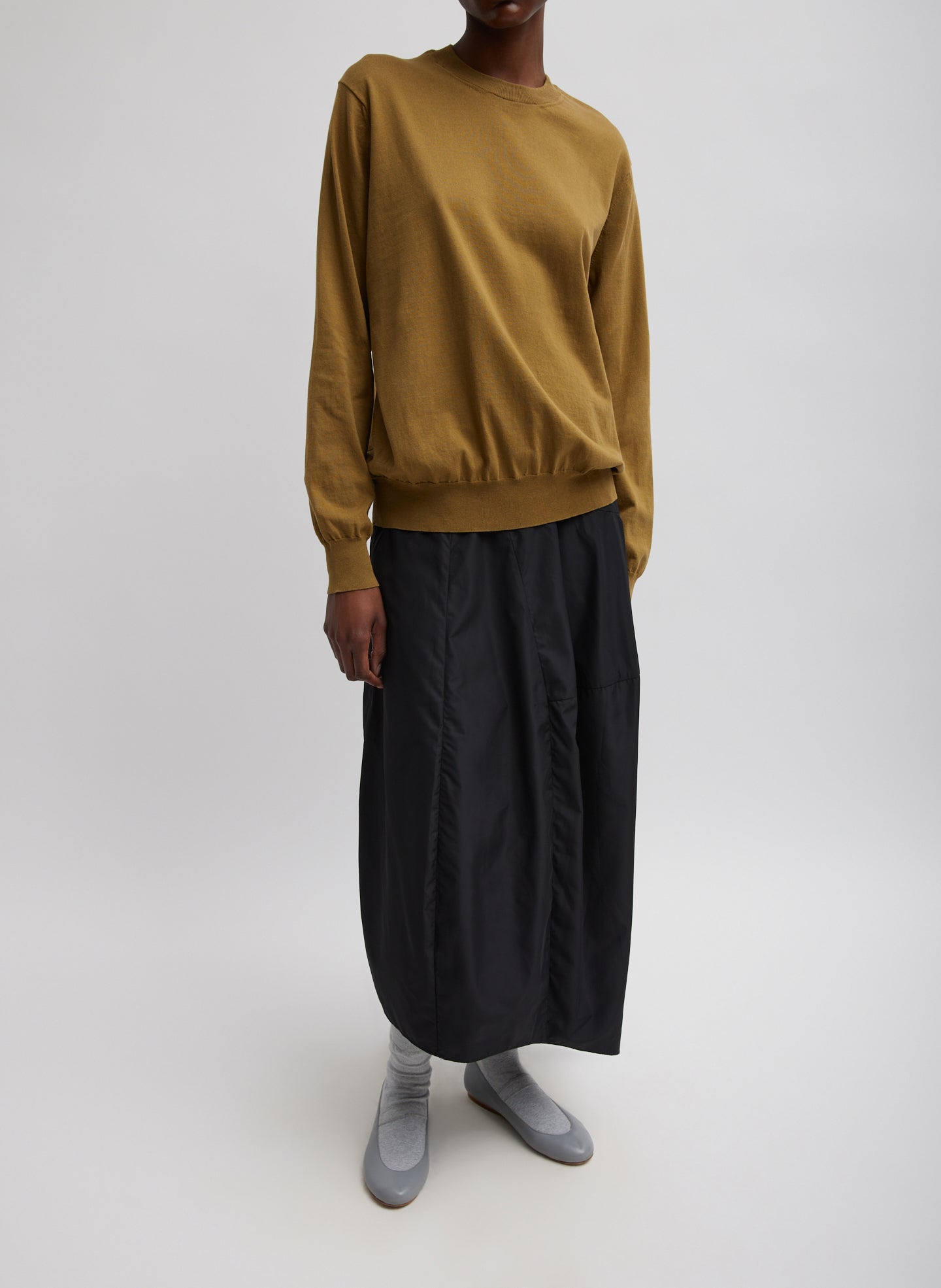 Black Nylon Asymmetrical Balloon Skirt - midi skirt, front view on model