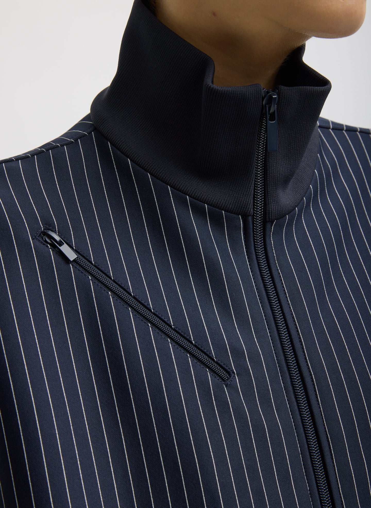 Navy Pinstripe Active Knit Zipper Detailed Track Jacket - close up of high neckline and pinstripe fabric