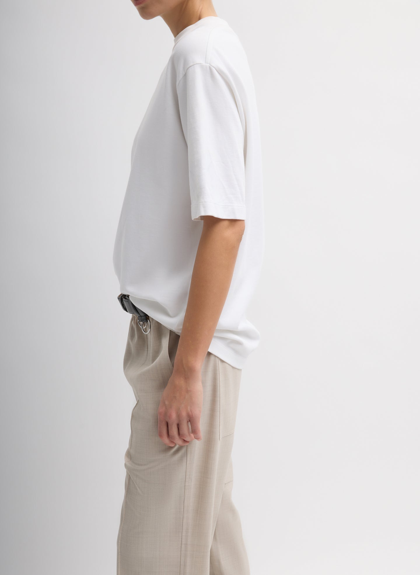 White Perfect Unisex T-Shirt - oversized tee, side view on model