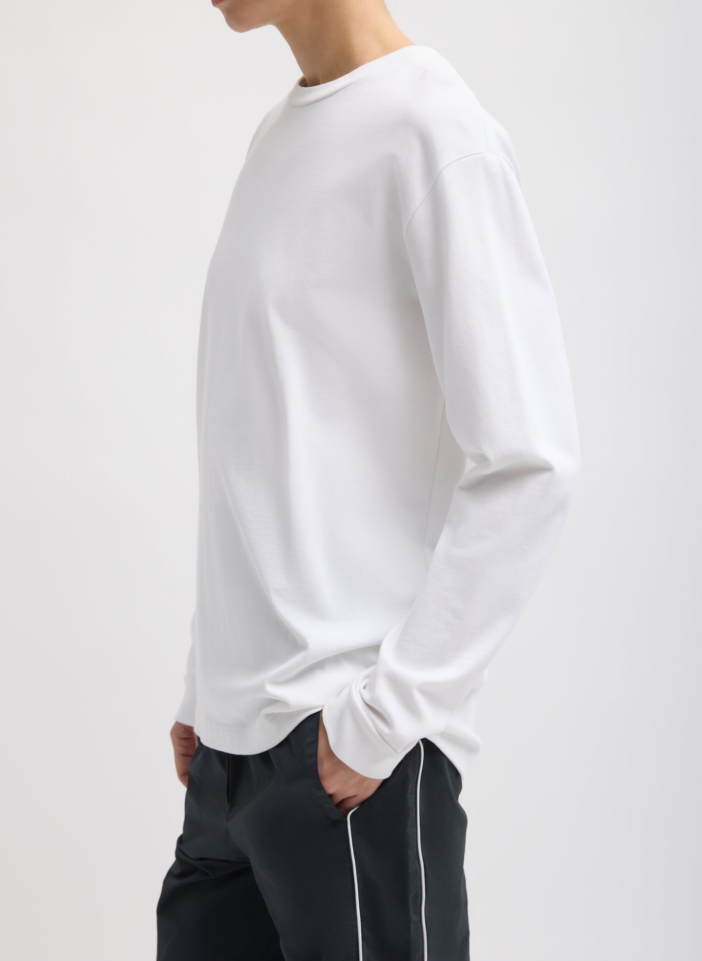 White Perfect Unisex Long Sleeve T-Shirt - long sleeve, side view on model