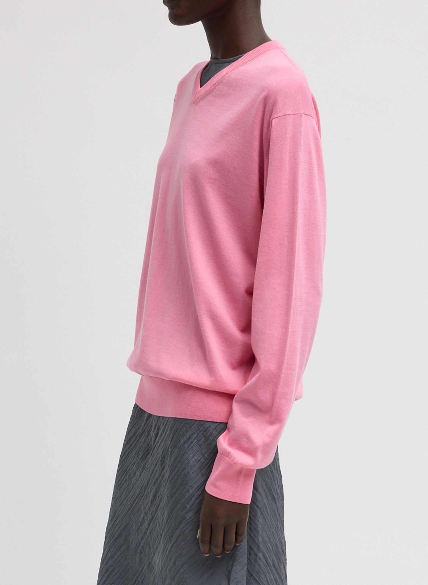 Bubble Gum Pink Super Fine Gauge V-Neck - think v-neck top, side view on model