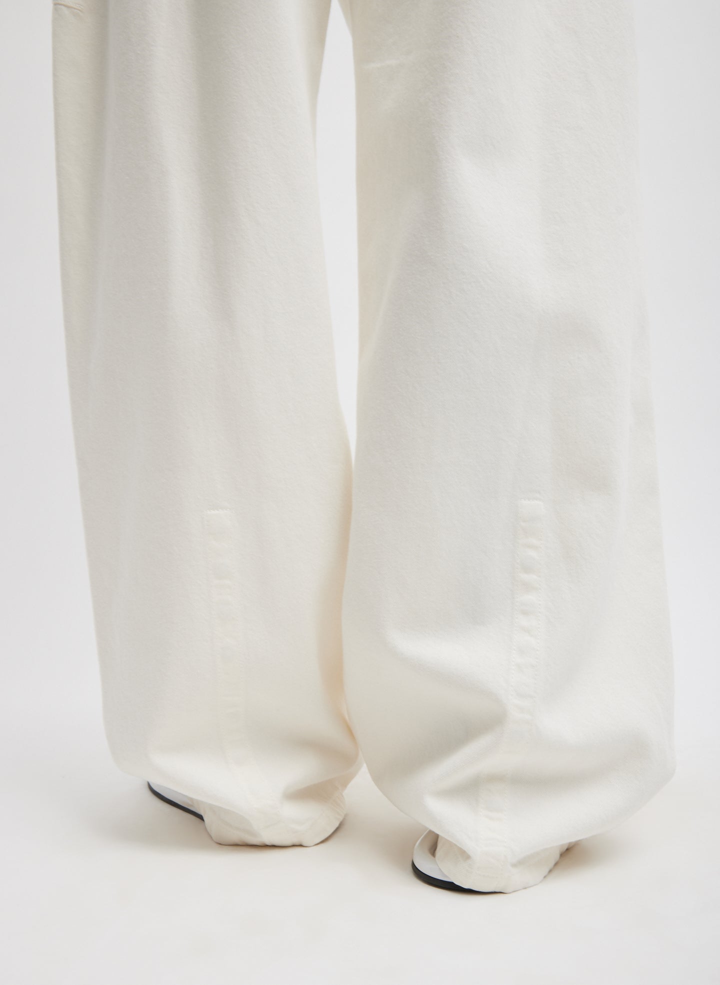 White Spring Denim Sid Jean - closeup of hidden snaps at hem